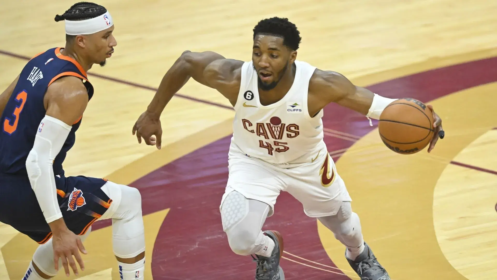 Apr 15, 2023; Cleveland, Ohio, USA; Cleveland Cavaliers guard Donovan Mitchell (45) dribbles beside New York Knicks guard Josh Hart (3) in the second quarter of game one of the 2023 NBA playoffs at Rocket Mortgage FieldHouse. / David Richard-USA TODAY Sports