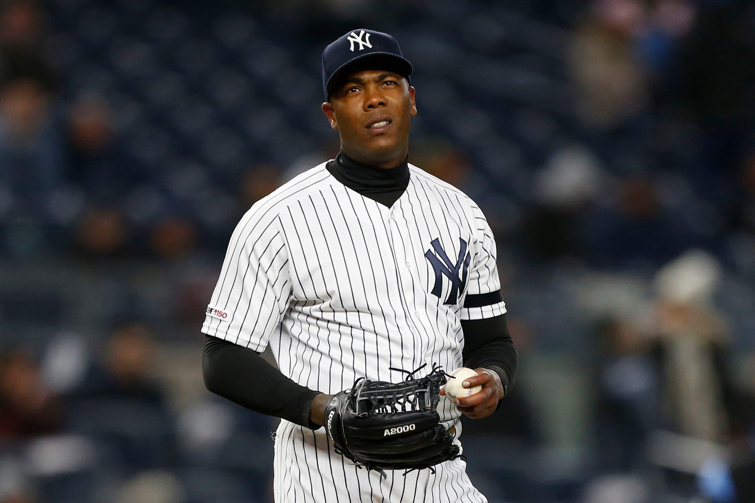 Apr 2, 2019; Bronx, NY, USA; New York Yankees relief pitcher Aroldis Chapman (54) reacts after giving up a run against the Detroit Tigers in the ninth inning at Yankee Stadium. Mandatory Credit: Noah K. Murray-USA TODAY Sports / Noah K. Murray