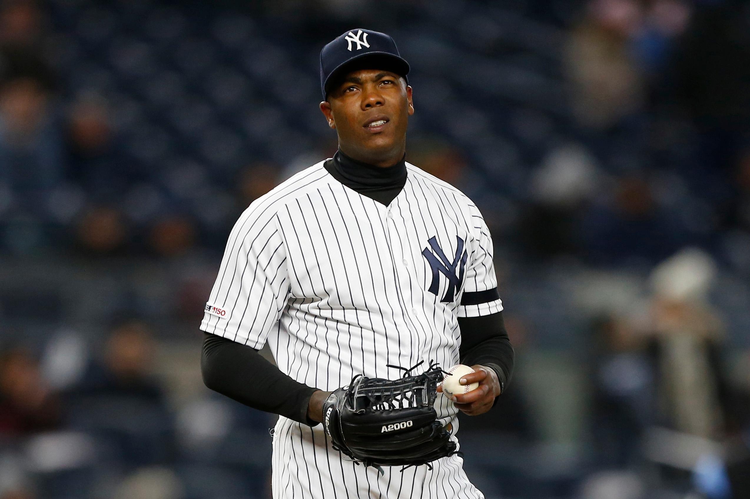 Apr 2, 2019; Bronx, NY, USA; New York Yankees relief pitcher Aroldis Chapman (54) reacts after giving up a run against the Detroit Tigers in the ninth inning at Yankee Stadium. Mandatory Credit: Noah K. Murray-USA TODAY Sports