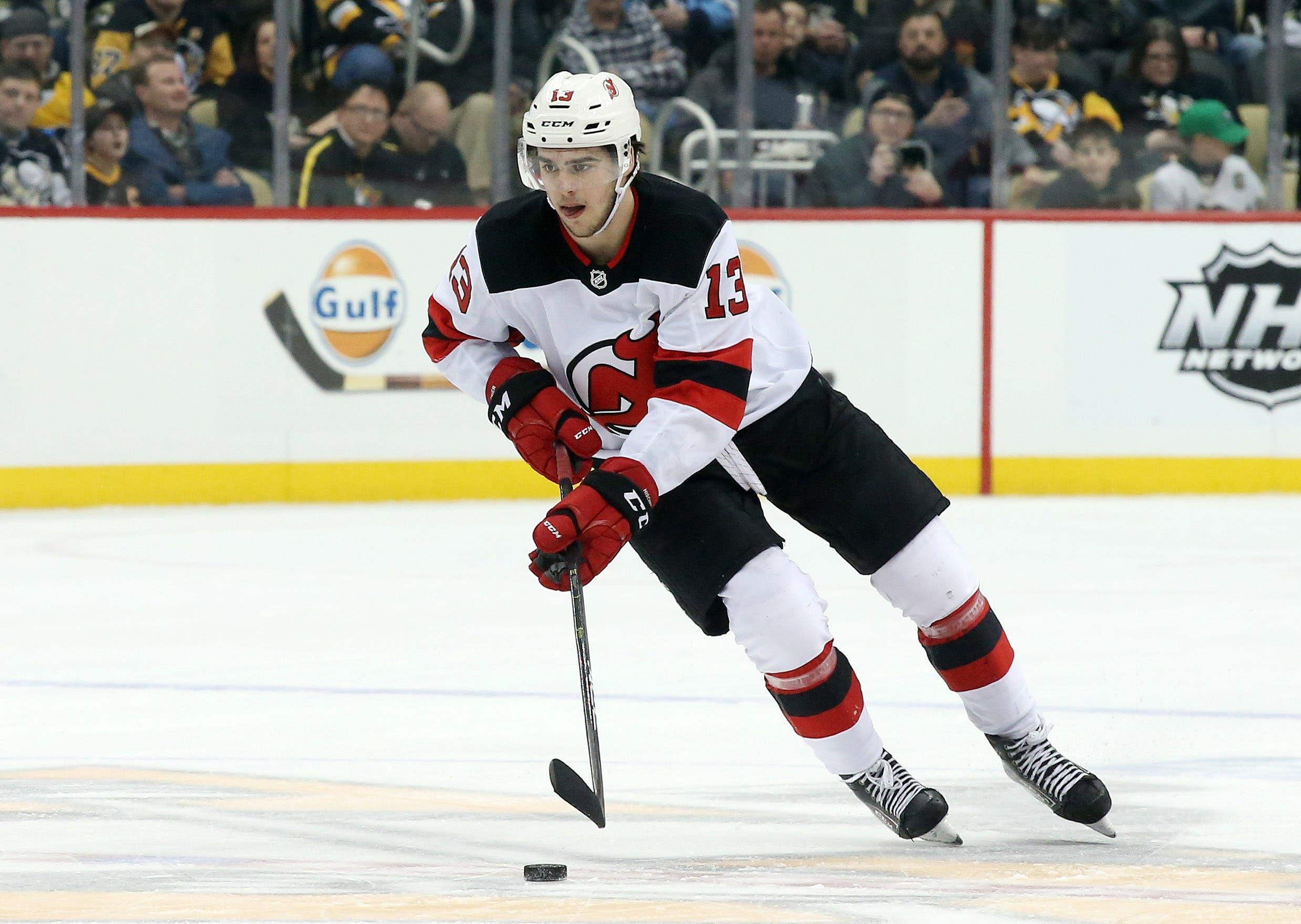 Jan 28, 2019; Pittsburgh, PA, USA; New Jersey Devils center Nico Hischier (13) skates with the puck against the Pittsburgh Penguins during the third period at PPG PAINTS Arena. The Devils won 6-3. Mandatory Credit: Charles LeClaire-USA TODAY Sports / Charles LeClaire