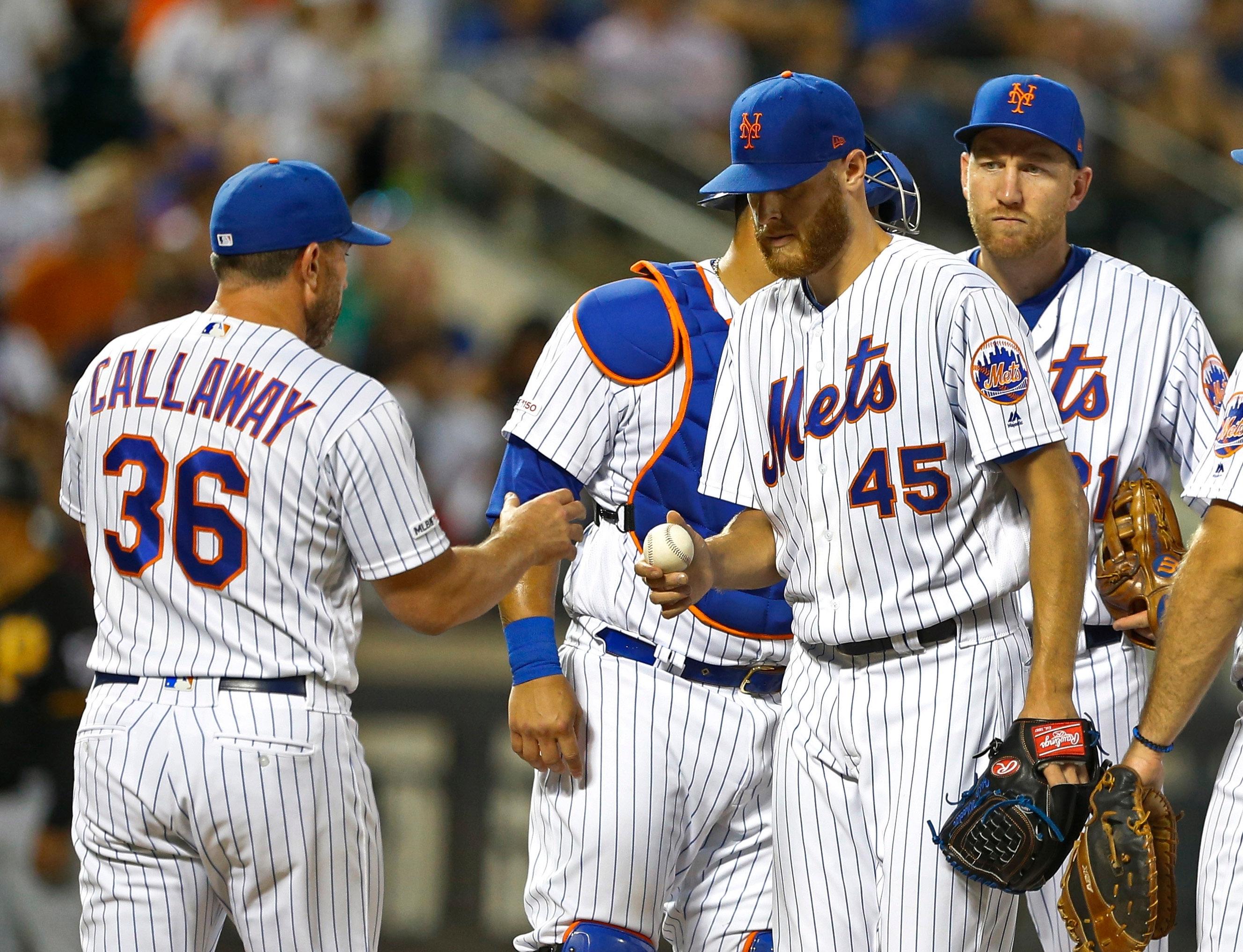 Jul 26, 2019; New York City, NY, USA; New York Mets manager Mickey Callaway (36) takes the ball from New York Mets starting pitcher Zack Wheeler (45) sixth inning against the Pittsburgh Pirates at Citi Field. Mandatory Credit: Noah K. Murray-USA TODAY Sports