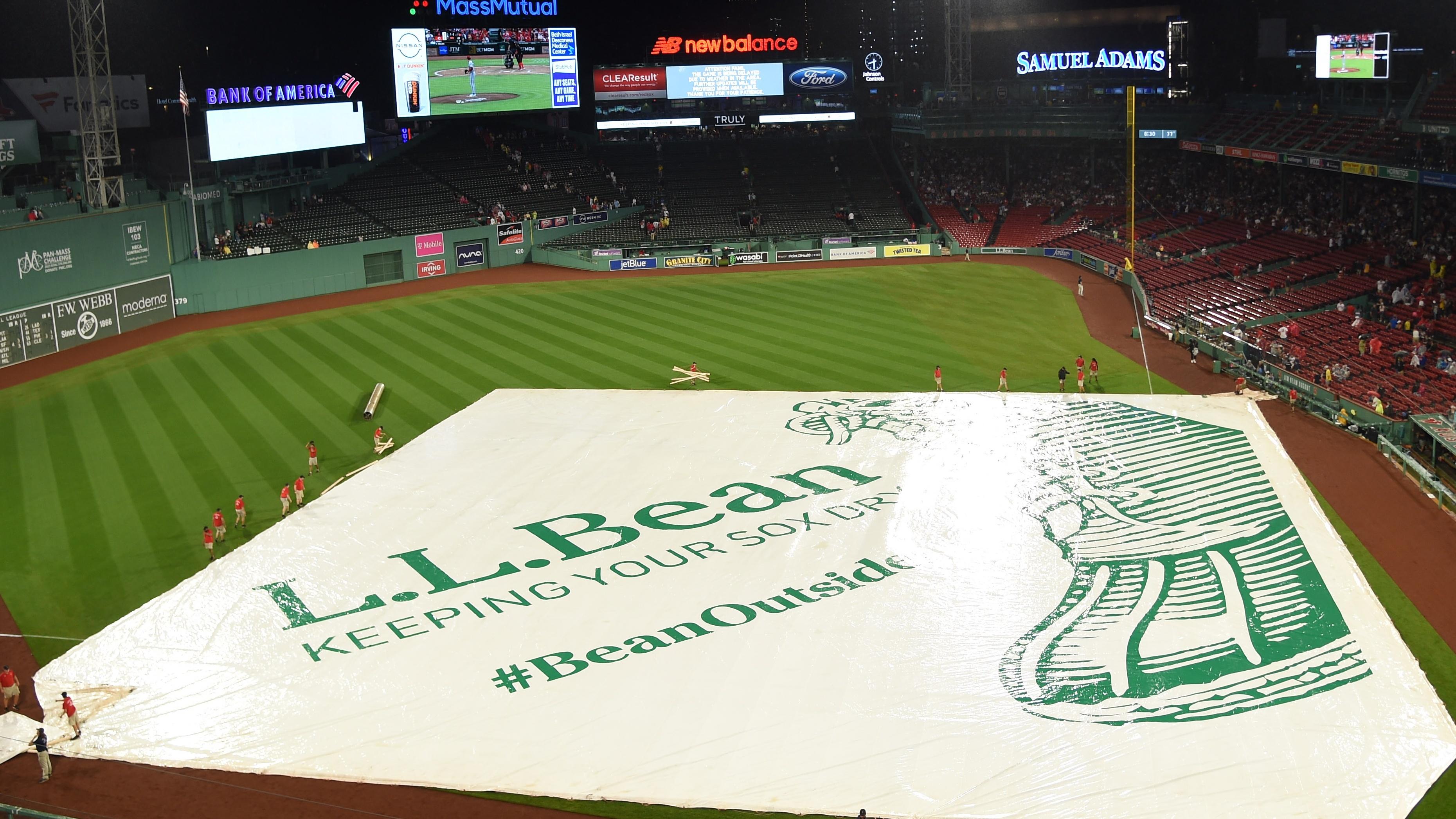 The Boston Red Sox grounds crew puts the tarp on the field during the fourth inning against the New York Mets at Fenway Park / Bob DeChiara - USA TODAY Sports