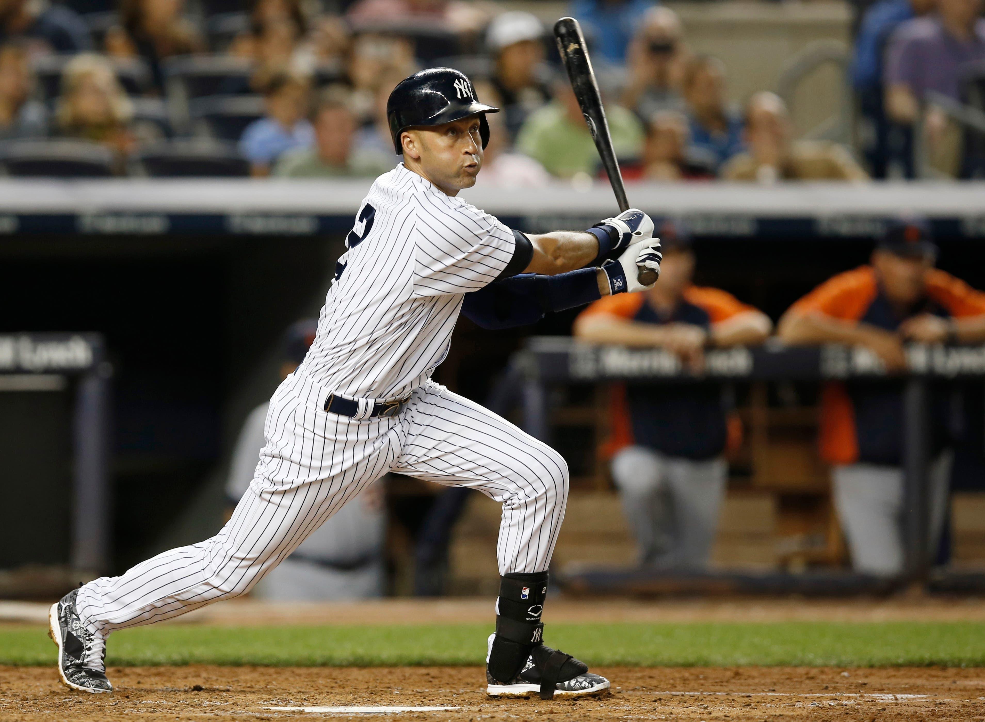 Derek Jeter follows through on a third-inning base hit. / AP