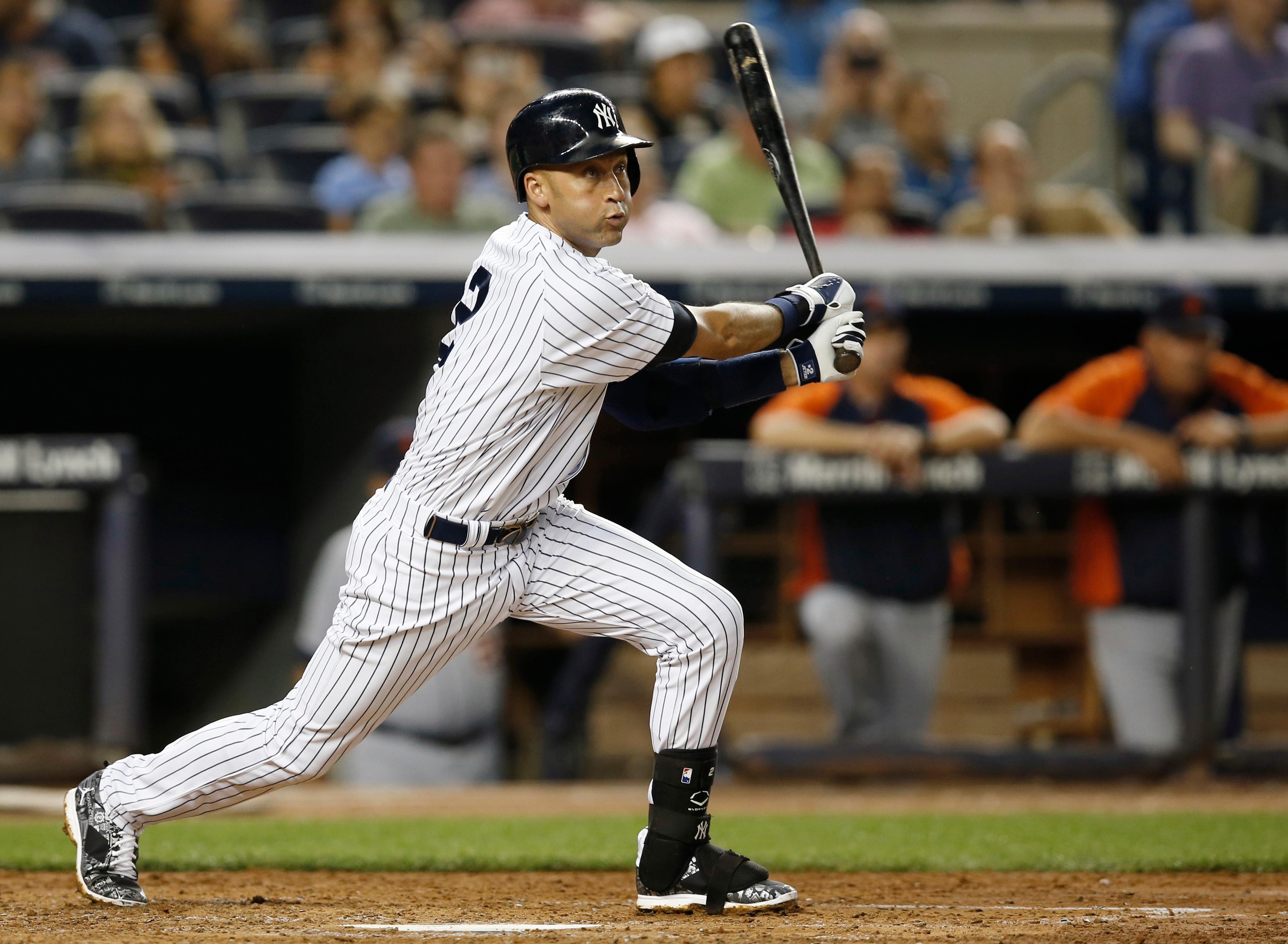 Derek Jeter follows through on a third-inning base hit.