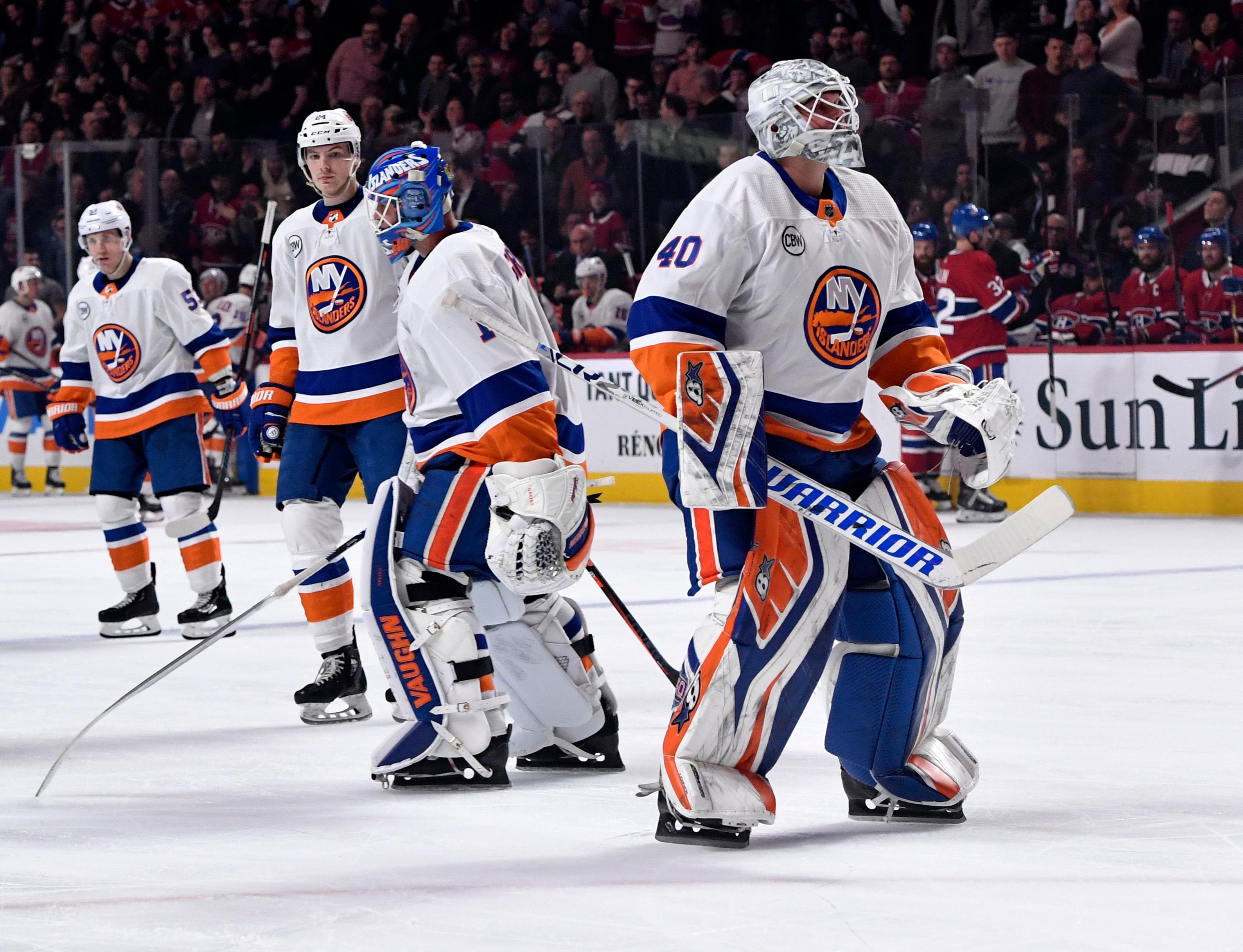 Mar 21, 2019; Montreal, Quebec, CAN; New York Islanders goalie Robin Lehner (40) replaces teammate Thomas Greiss (1) during the second period of the game against the Montreal Canadiens at the Bell Centre. Mandatory Credit: Eric Bolte-USA TODAY Sports