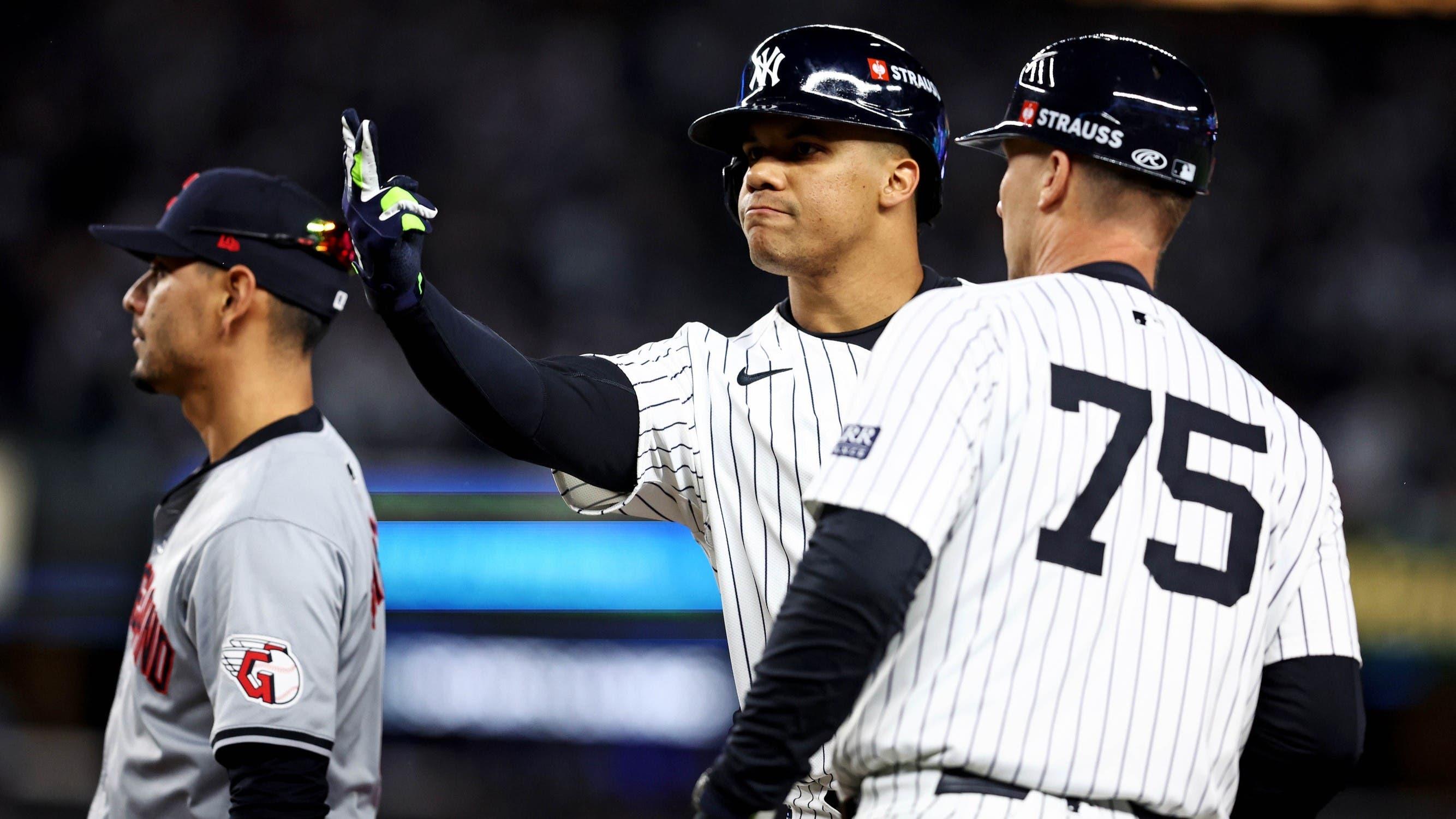 Oct 15, 2024; Bronx, New York, USA; New York Yankees outfielder Juan Soto (22) celebrates after hitting a single during the first inning against the Cleveland Guardians in game two of the ALCS for the 2024 MLB Playoffs at Yankee Stadium.