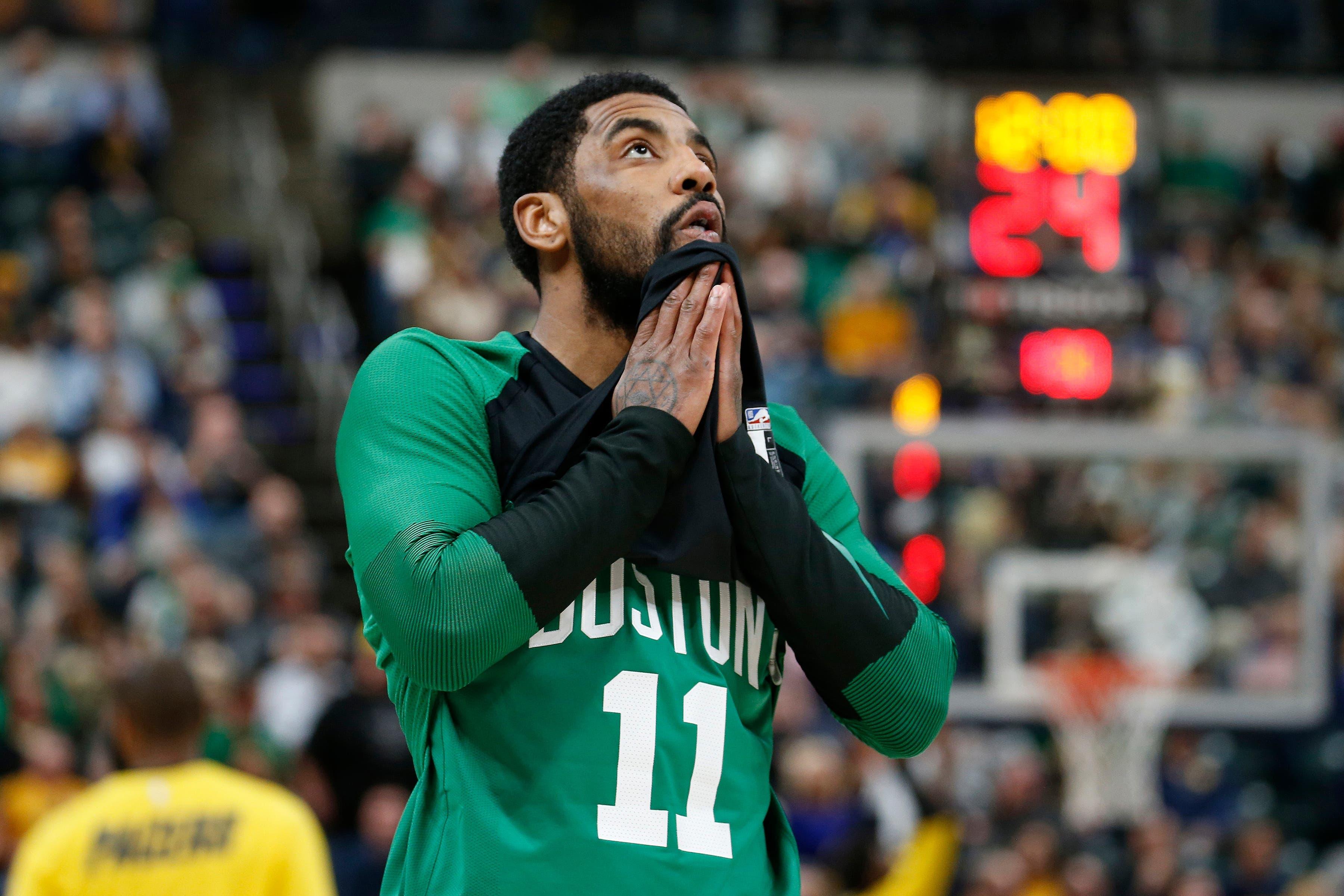 Apr 5, 2019; Indianapolis, IN, USA; Boston Celtics guard Kyrie Irving (11) warms up before the game against the Indiana Pacers at Bankers Life Fieldhouse. Mandatory Credit: Brian Spurlock-USA TODAY Sports / Brian Spurlock