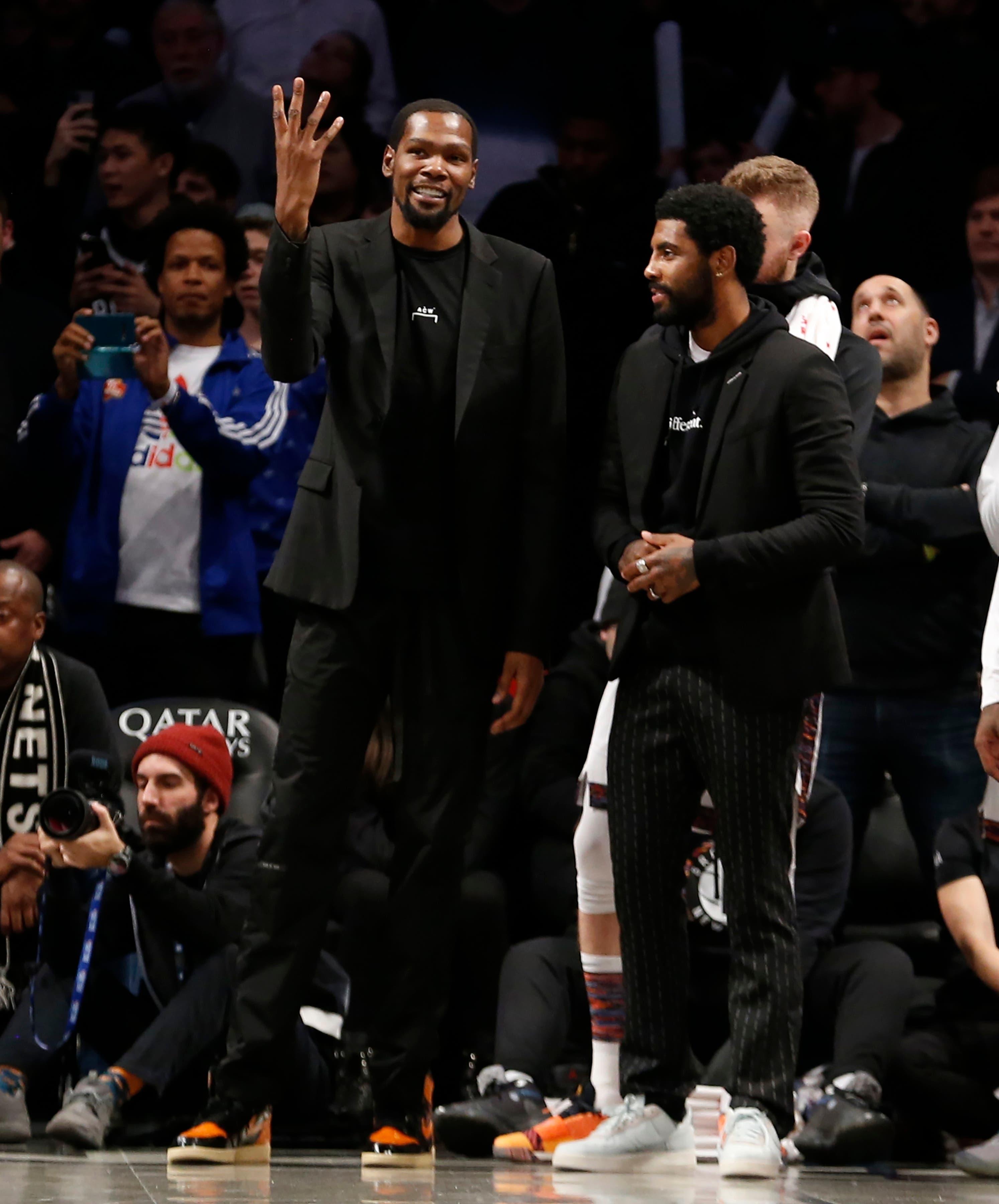 Dec 1, 2019; Brooklyn, NY, USA; Brooklyn Nets forward Kevin Durant (7) and guard Kyrie Irving (11) react in the fourth quarter against the Miami Heat at Barclays Center. Mandatory Credit: Nicole Sweet-USA TODAY Sports / Nicole Sweet