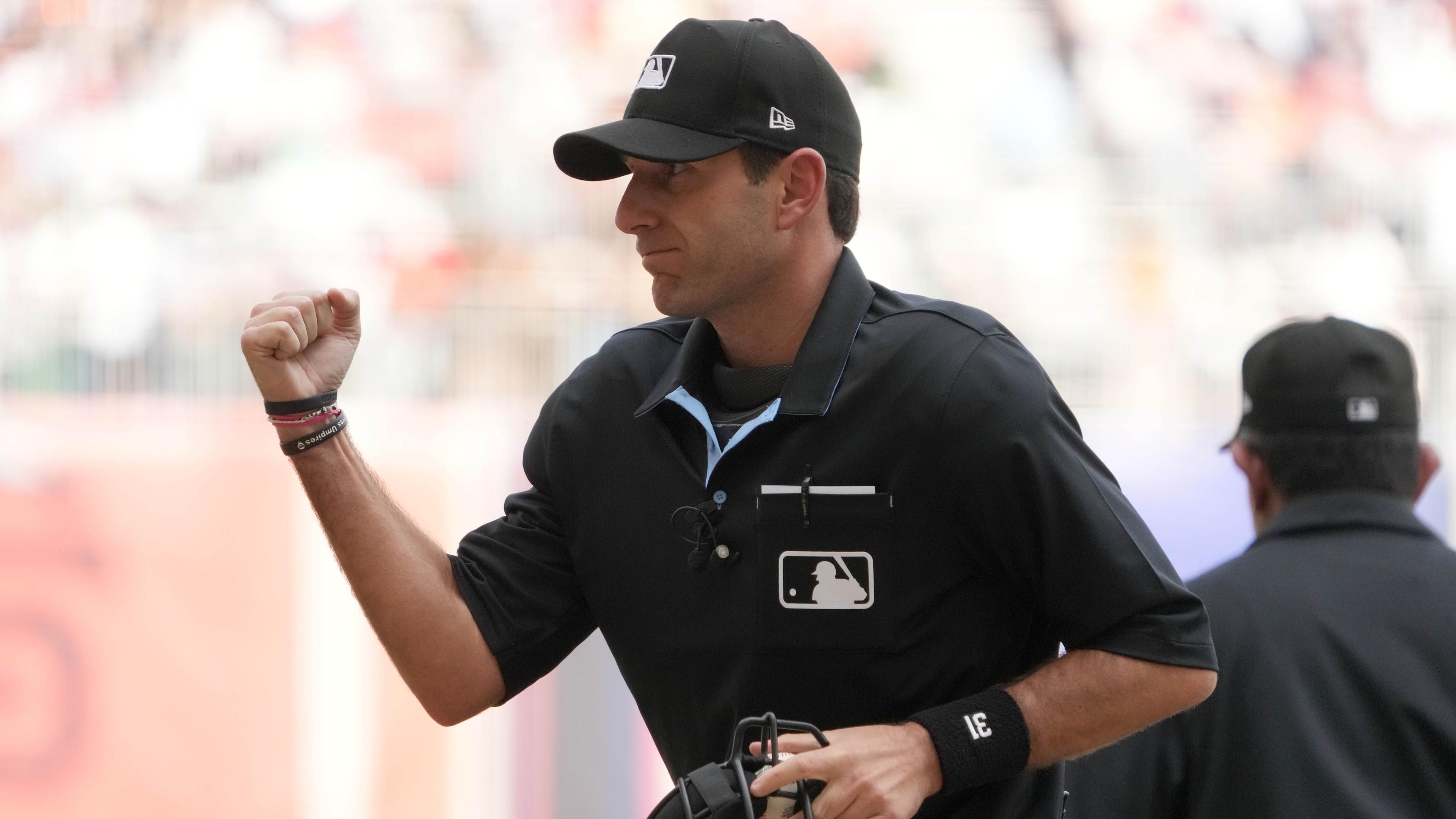 Apr 30, 2023; Mexico City, Mexico; Home plate umpire Pat Hoberg (31) calls an out in the fifth inning during a MLB World Tour game between the San Diego Padres and the San Francisco Giants at Estadio Alfredo Harp Helu. / Kirby Lee-USA TODAY Sports