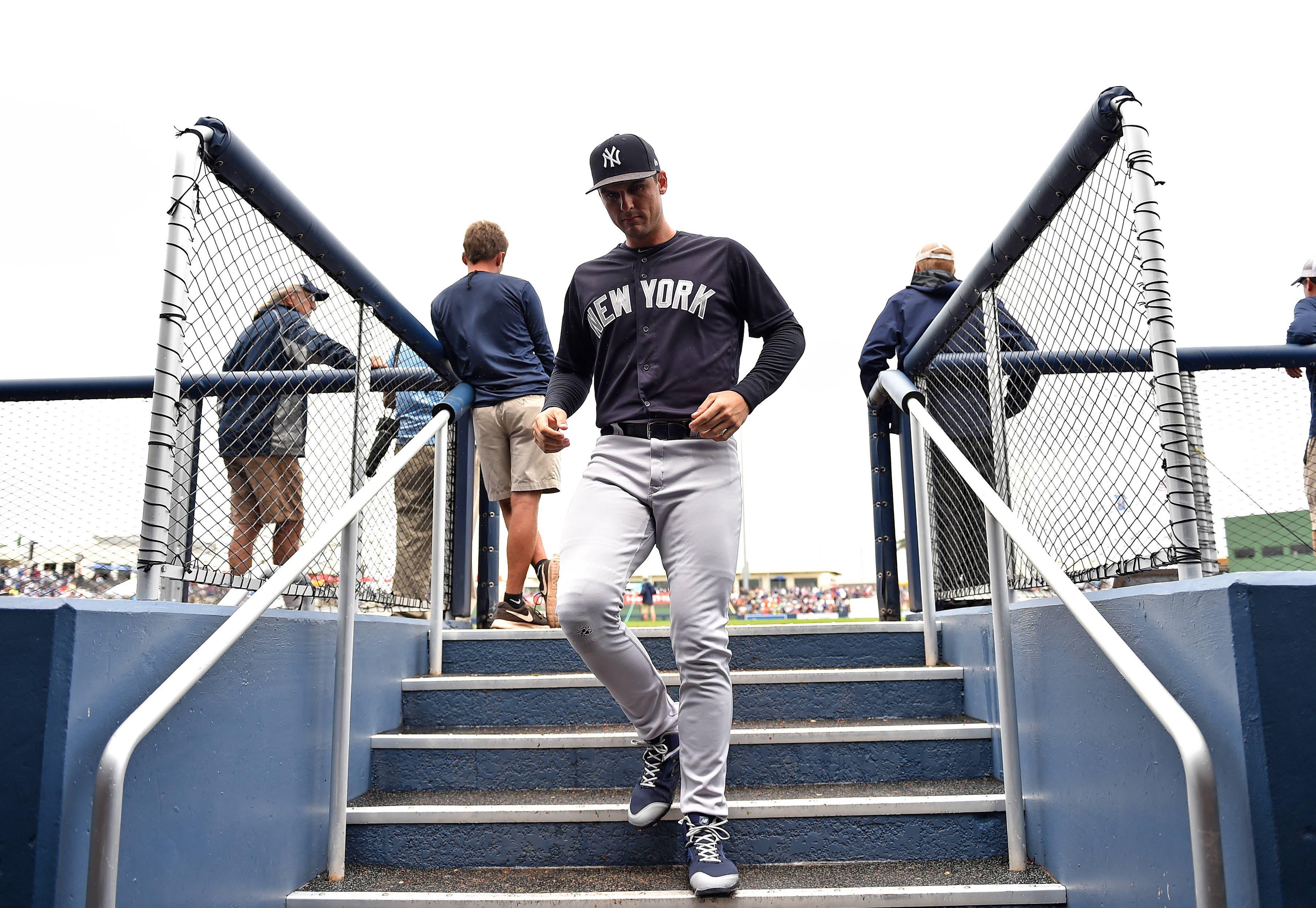 New York Yankees first baseman Greg Bird heads into the dugout before a spring training game against the Houston Astros at FITTEAM Ballpark of the Palm Beaches. / Steve Mitchell/USA TODAY Sports