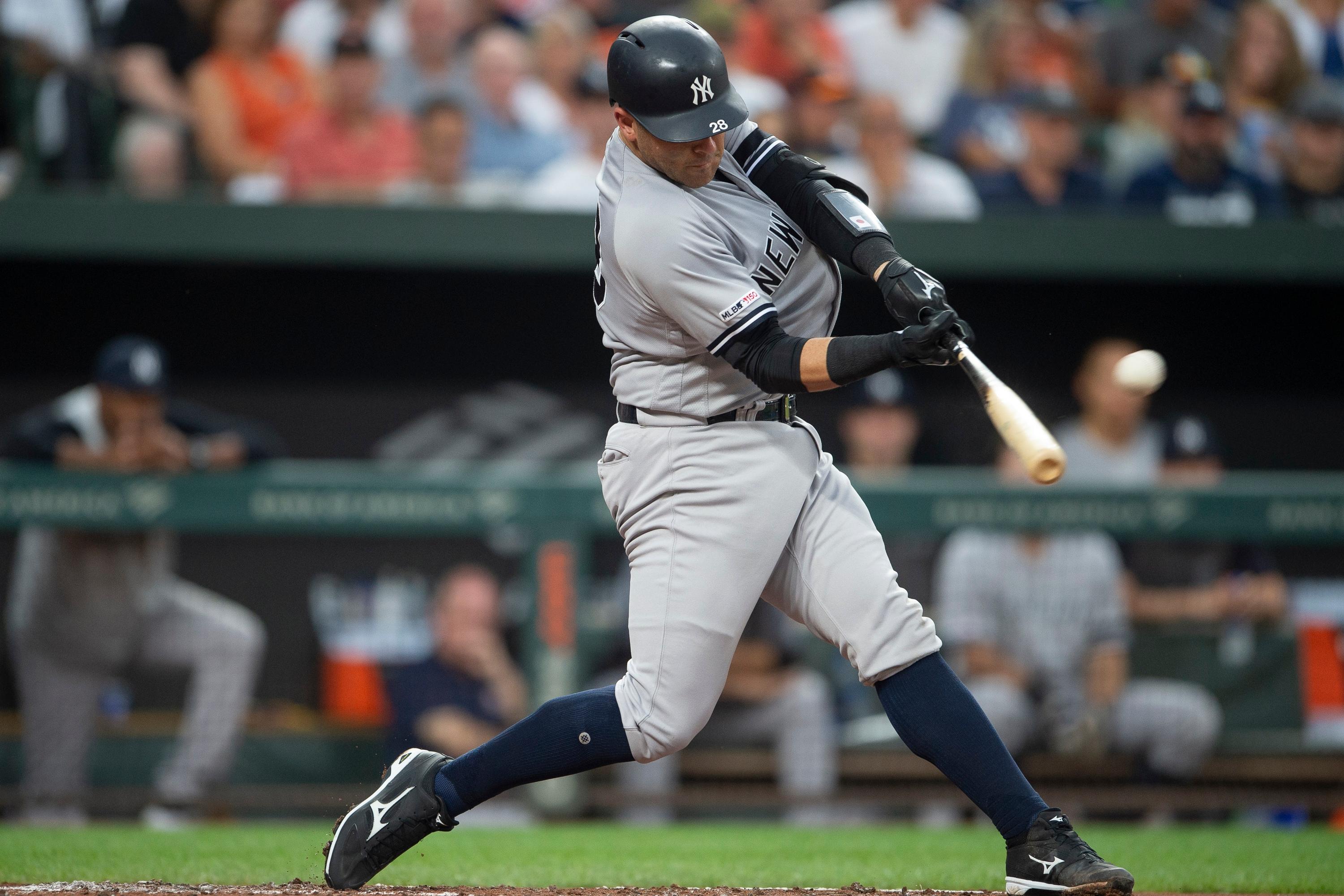 Aug 5, 2019; Baltimore, MD, USA; New York Yankees catcher Austin Romine (28) hits a solo home run in the second inning against the Baltimore Orioles at Oriole Park at Camden Yards. Mandatory Credit: Tommy Gilligan-USA TODAY Sports