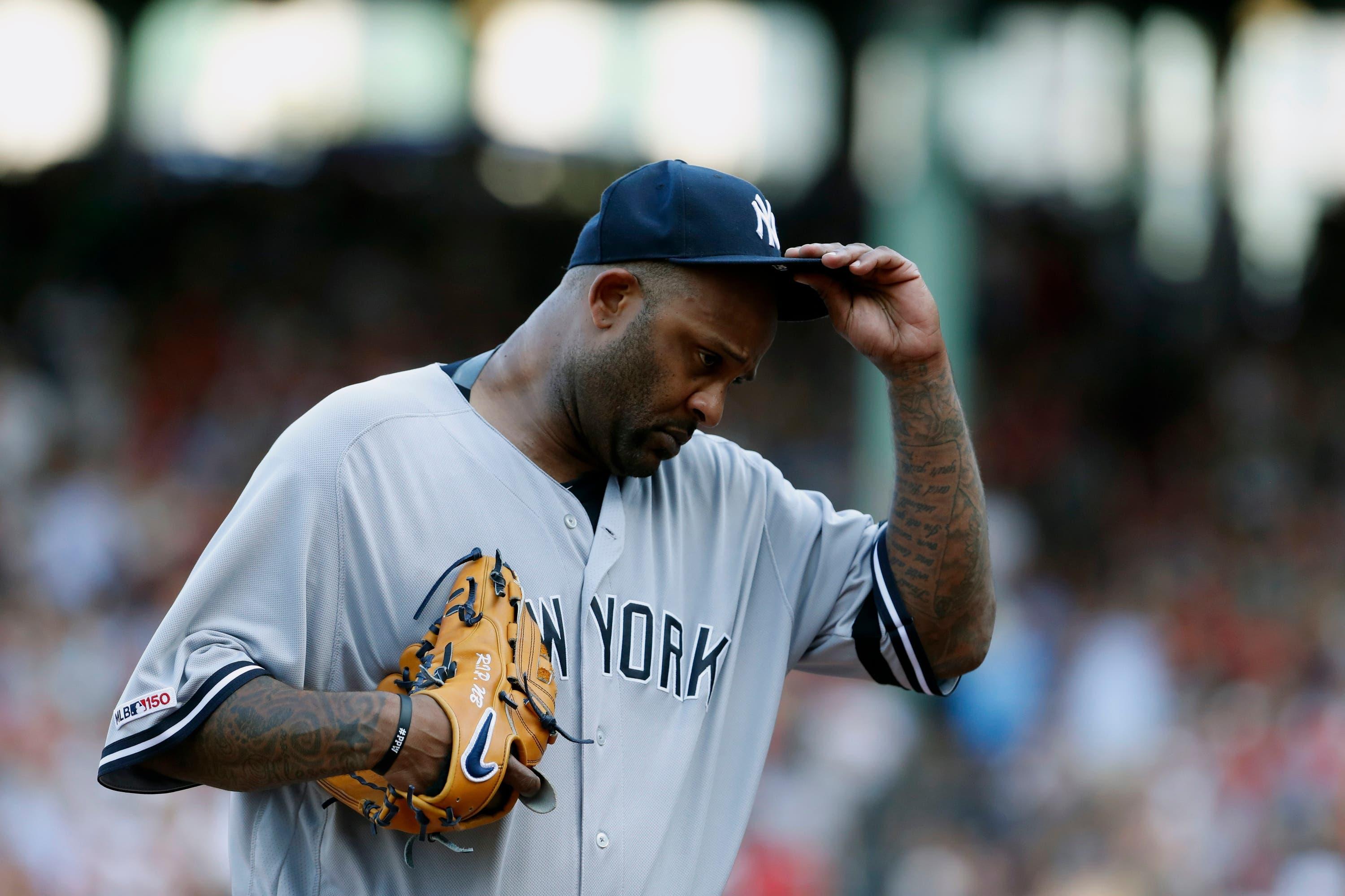 Jul 27, 2019; Boston, MA, USA; New York Yankees starting pitcher CC Sabathia (52) tips his hat to the crowd as he is taken out of the game against the Boston Red Sox in the first inning at Fenway Park. Mandatory Credit: David Butler II-USA TODAY Sports / David Butler II