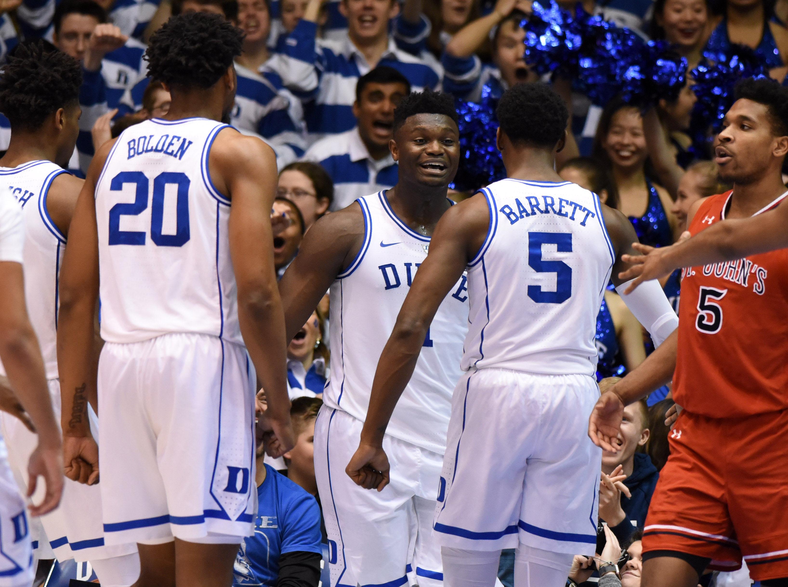 Duke Blue Devils forward Zion Williamson and forward R.J. Barrett react during the second half against the St. John's Red Storm at Cameron Indoor Stadium.