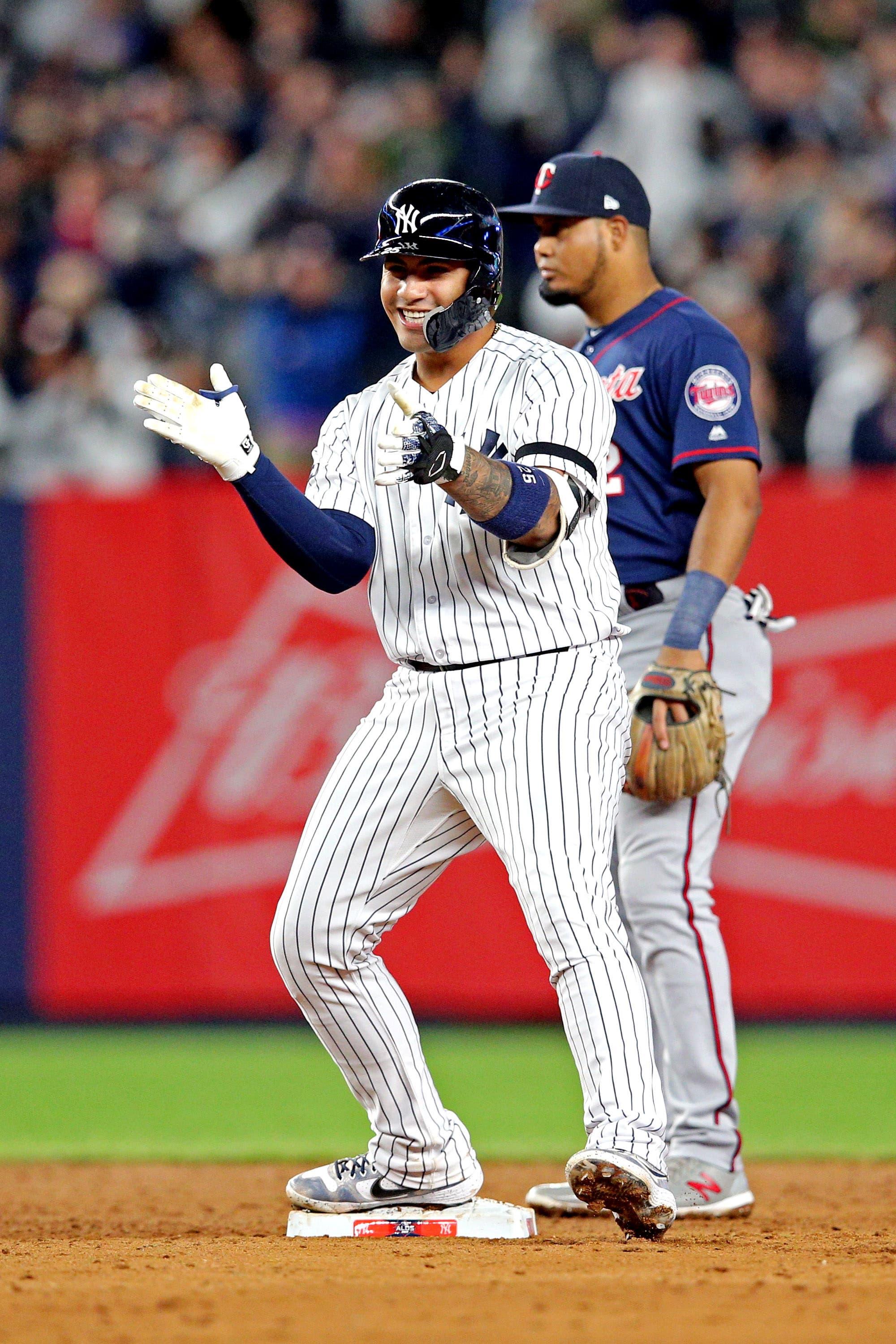 Oct 4, 2019; Bronx, NY, USA; New York Yankees second baseman Gleyber Torres (25) reacts after hitting a two RBI double during the fifth inning against the Minnesota Twins in game one of the 2019 ALDS playoff baseball series at Yankee Stadium. Mandatory Credit: Brad Penner-USA TODAY Sports / Brad Penner