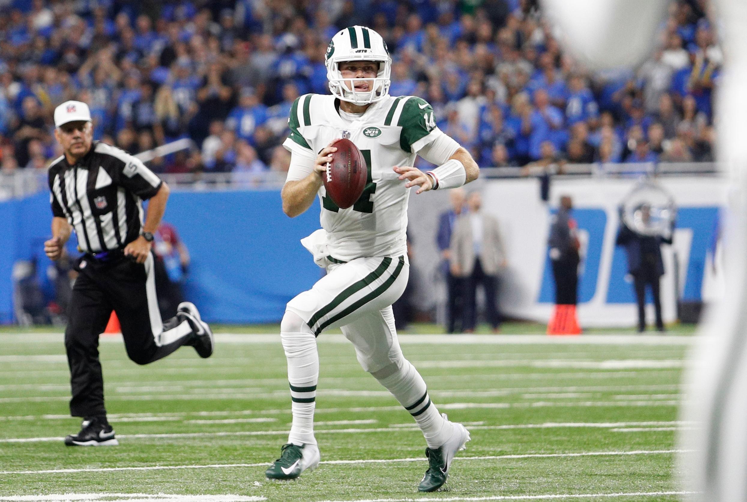 New York Jets quarterback Sam Darnold looks for an open man during the first quarter against the Detroit Lions at Ford Field.