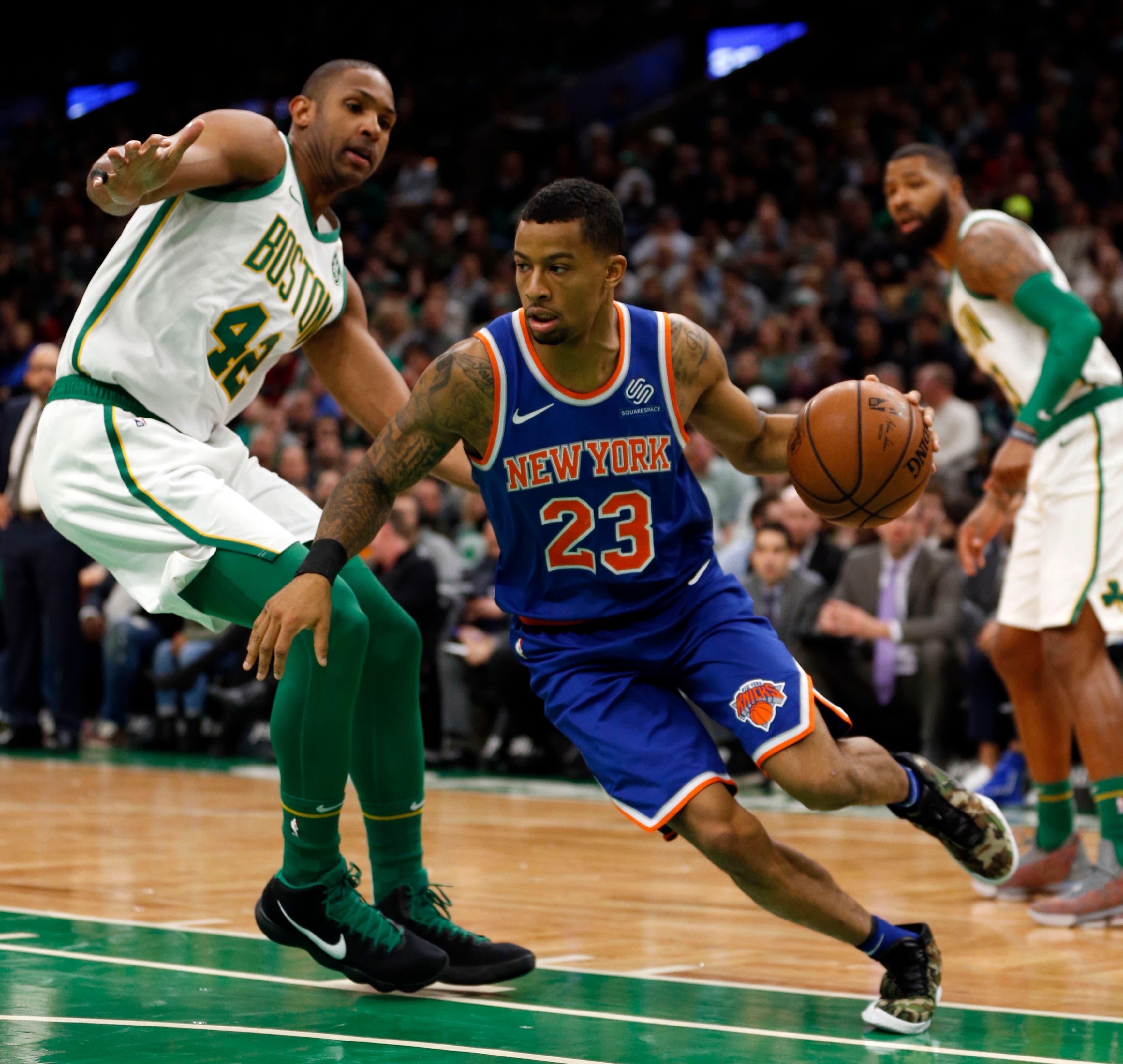 Nov 21, 2018; Boston, MA, USA; New York Knicks point guard Trey Burke (23) is guarded by Boston Celtics center Al Horford (42) during the first half at TD Garden. Mandatory Credit: Greg M. Cooper-USA TODAY Sports / Greg M. Cooper