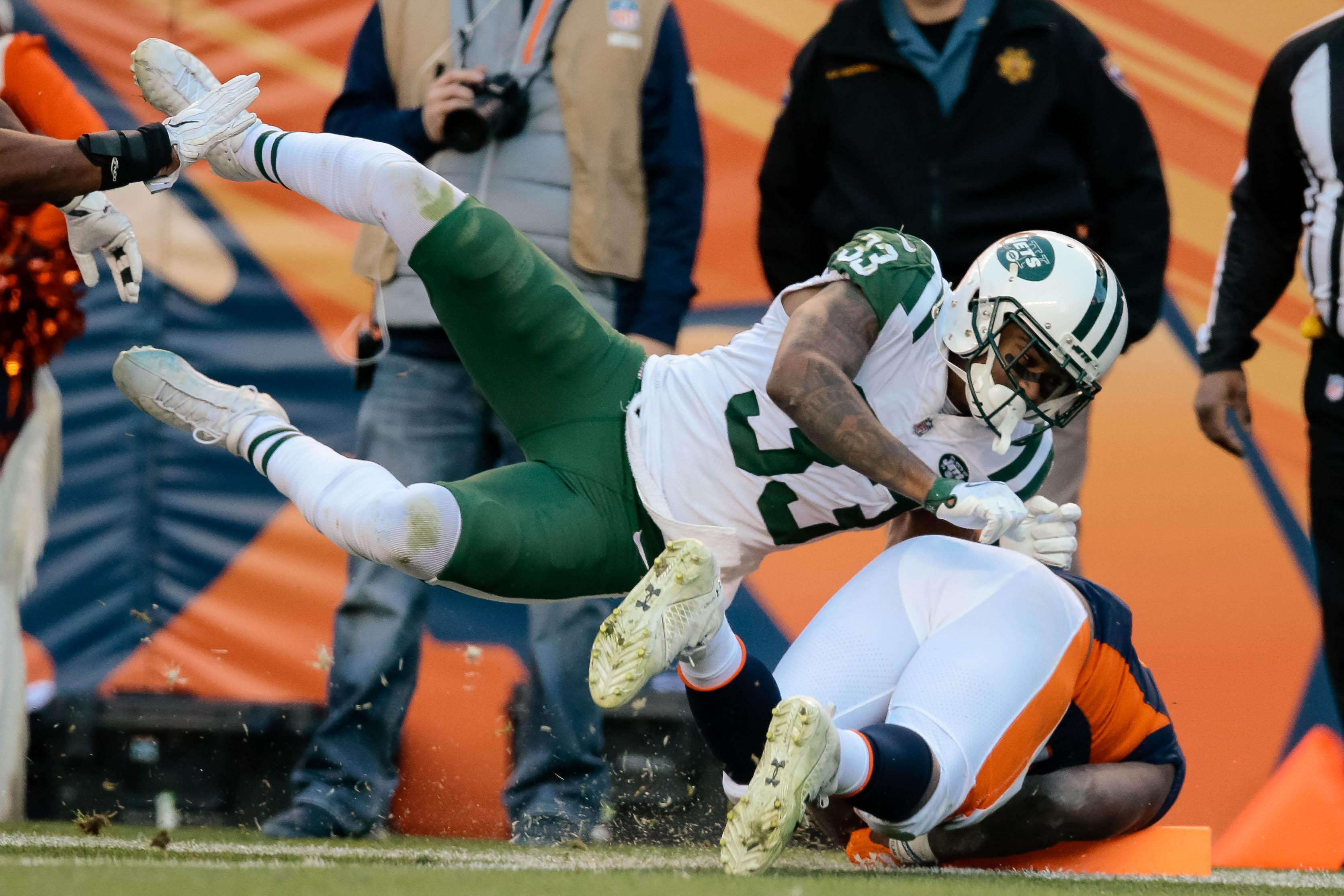 New York Jets strong safety Jamal Adams tackles Denver Broncos running back C.J. Anderson short of the goal line in the third quarter at Sports Authority Field at Mile High.