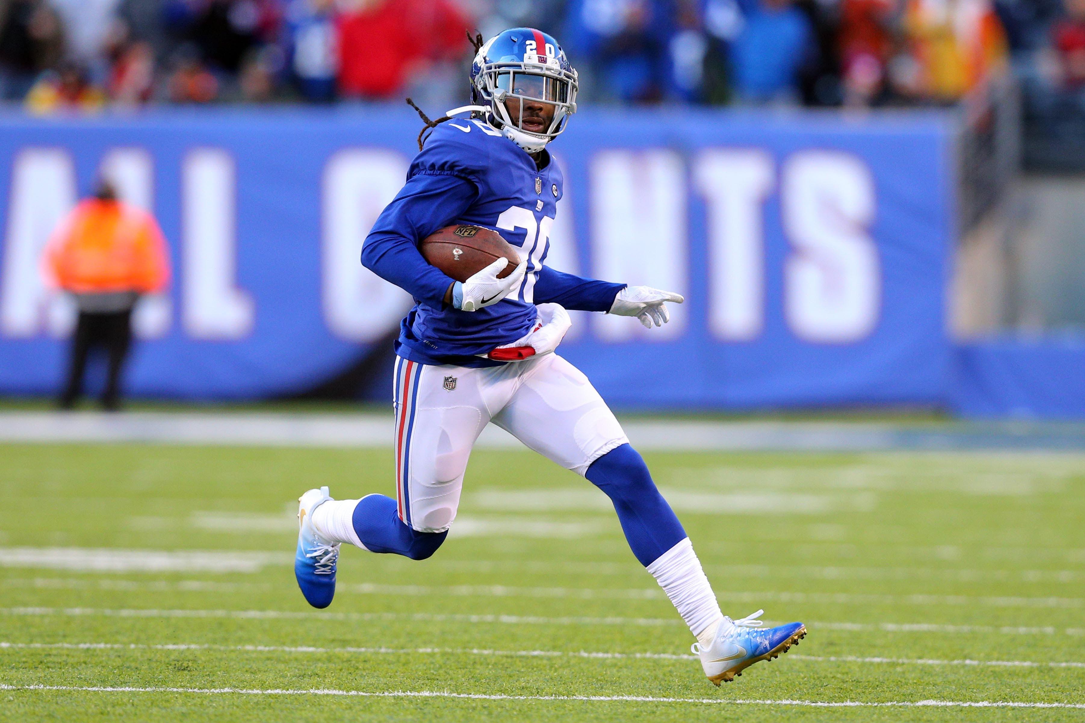 Nov 19, 2017; East Rutherford, NJ, USA; New York Giants corner back Janoris Jenkins (20) runs back an interception against the Kansas City Chiefs during the fourth quarter at MetLife Stadium. Mandatory Credit: Brad Penner-USA TODAY Sports / Brad Penner