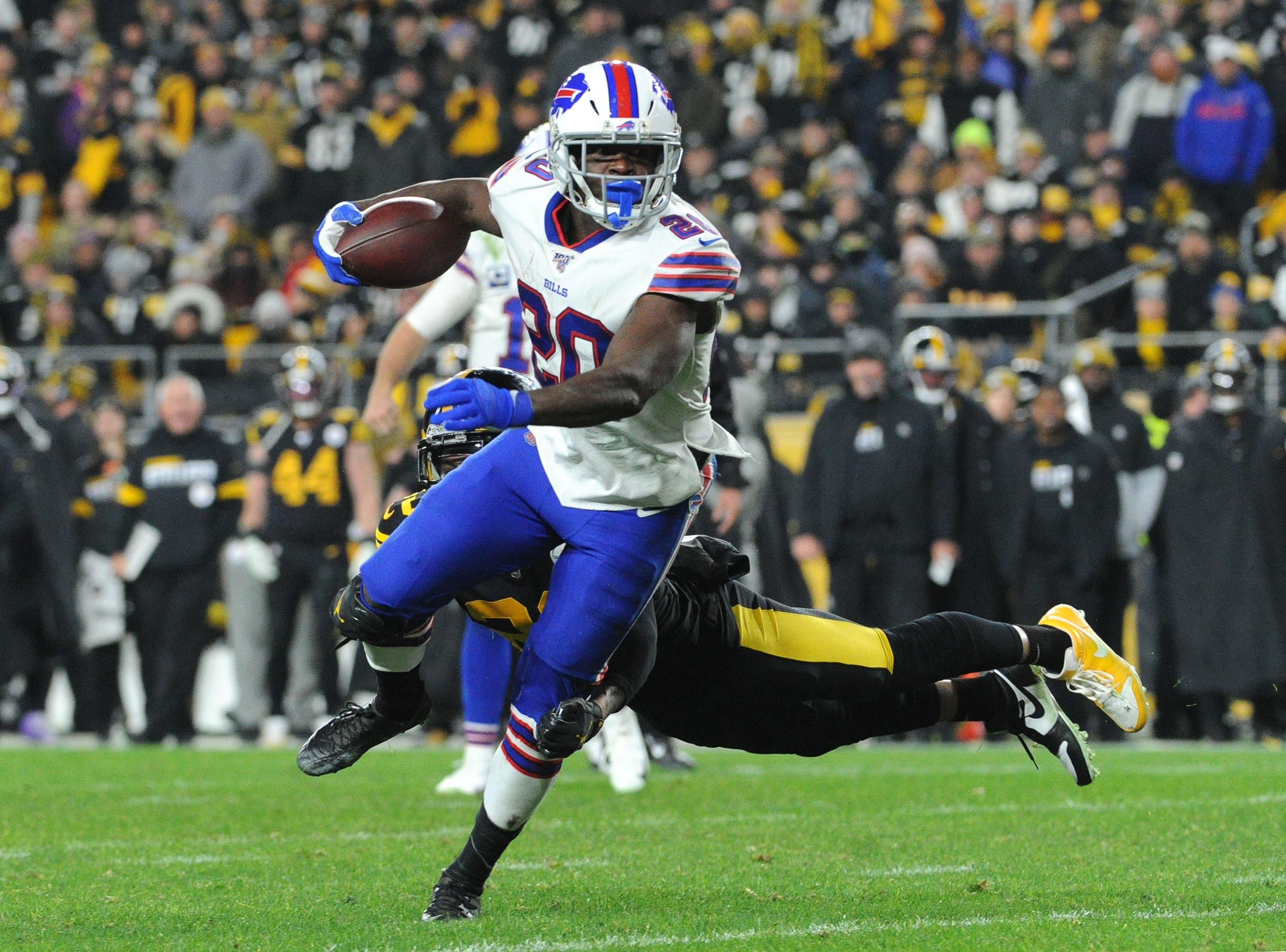 Dec 15, 2019; Pittsburgh, PA, USA; Buffalo Bills running back Frank Gore (20) is pressured by Pittsburgh Steelers cornerback Joe Haden (23) during the fourth quarter at Heinz Field. Mandatory Credit: Philip G. Pavely-USA TODAY Sports / Philip G. Pavely