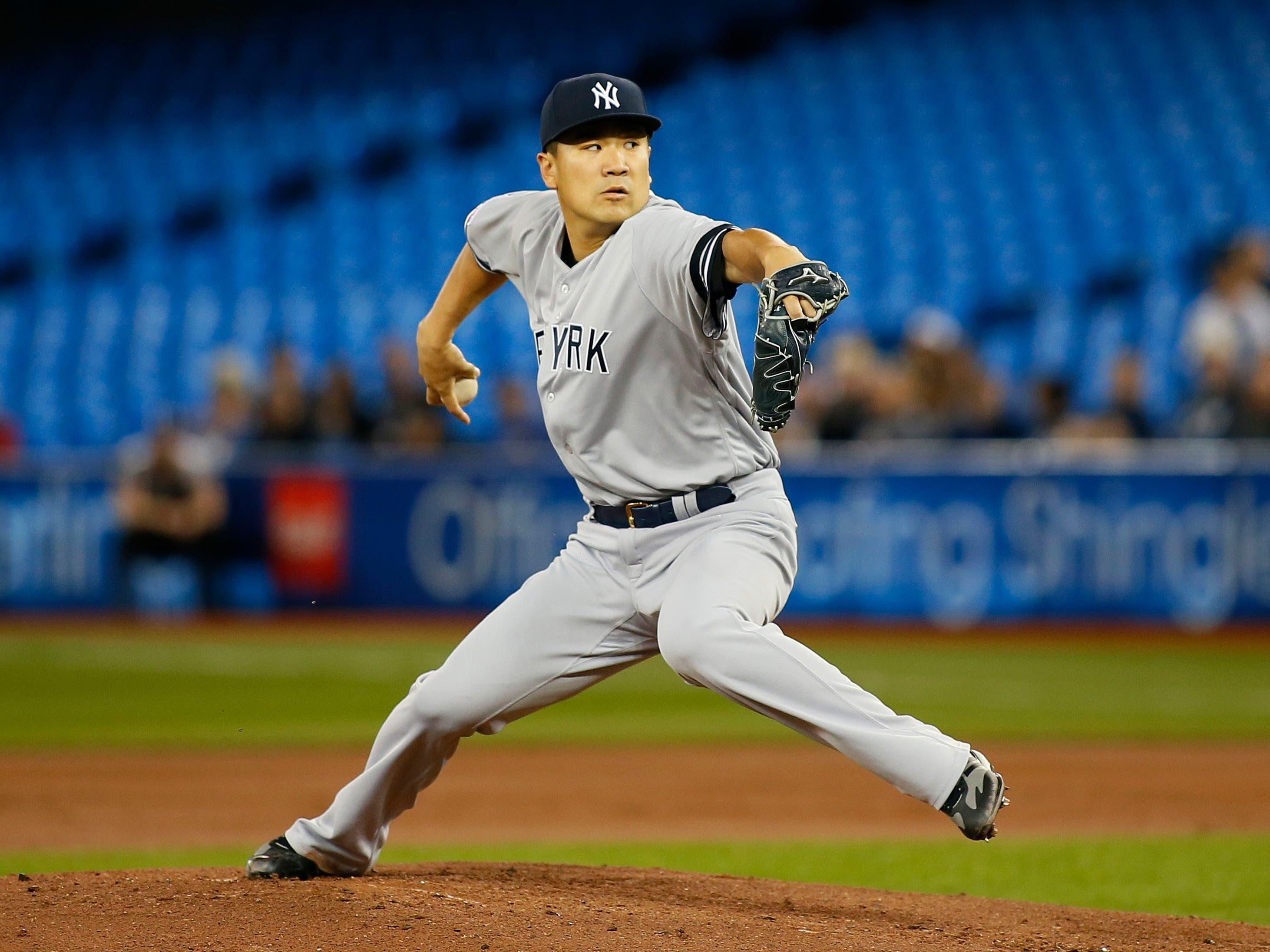 Jun 4, 2019; Toronto, Ontario, CAN; New York Yankees pitcher Masahiro Tanaka (19) pitches to Toronto Blue Jays during the first inning at Rogers Centre. Mandatory Credit: John E. Sokolowski-USA TODAY Sports / John E. Sokolowski