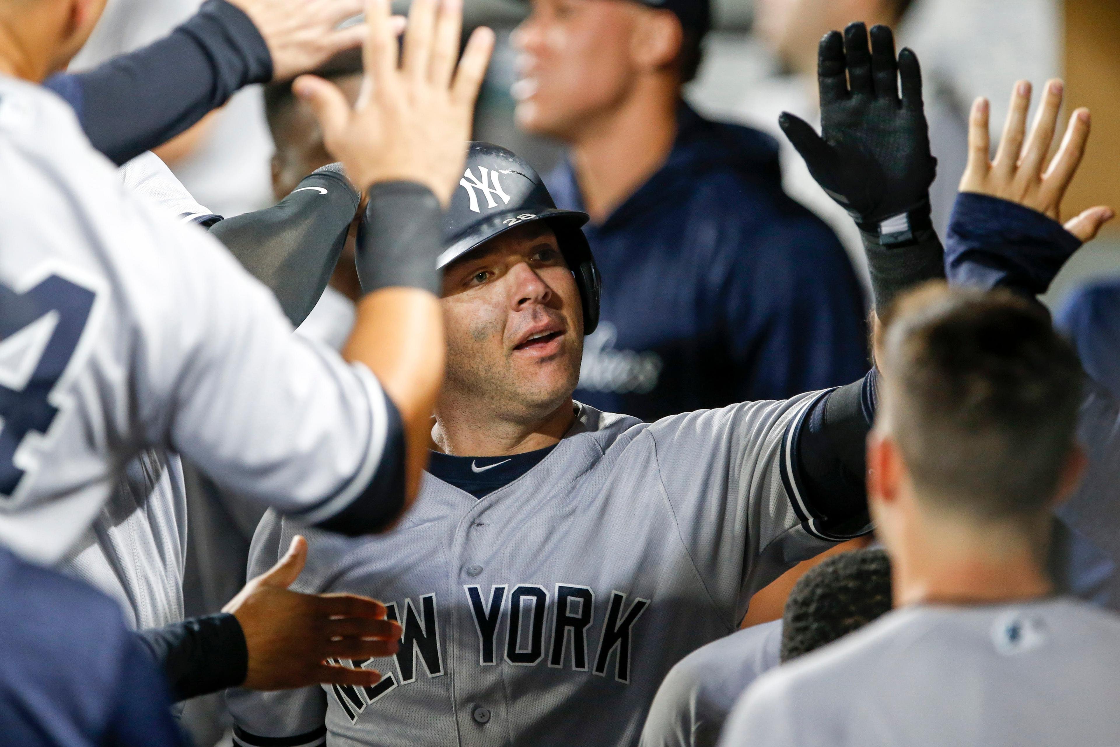 Sep 8, 2018; Seattle, WA, USA; New York Yankees catcher Austin Romine (28) is greeted in the dugout after hitting a solo homer against the Seattle Mariners during the seventh inning at Safeco Field. Mandatory Credit: Joe Nicholson-USA TODAY Sports / Joe Nicholson