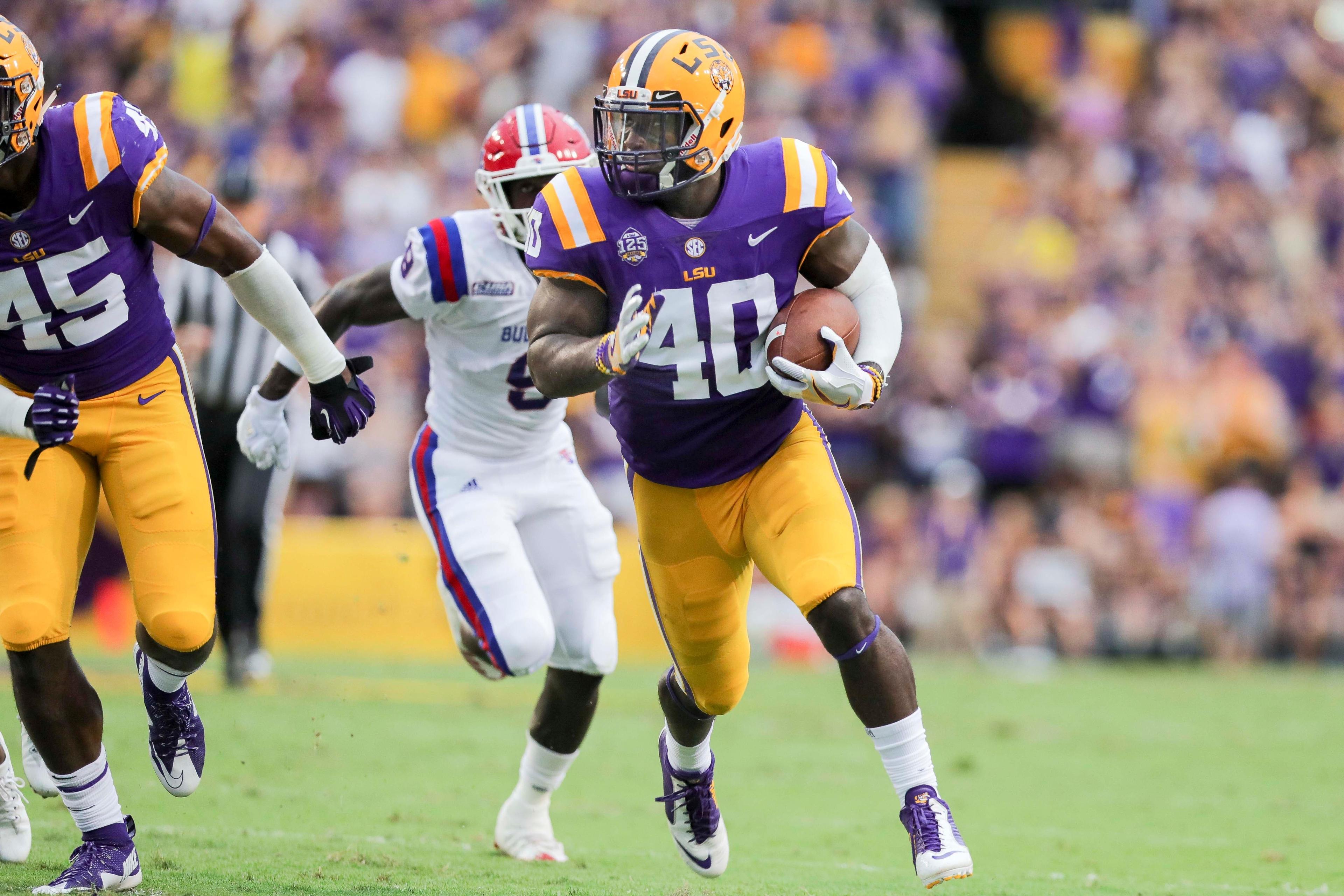 LSU Tigers linebacker Devin White returns a fumble against Louisiana Tech Bulldogs at Tiger Stadium. / Stephen Lew/USA TODAY Sports