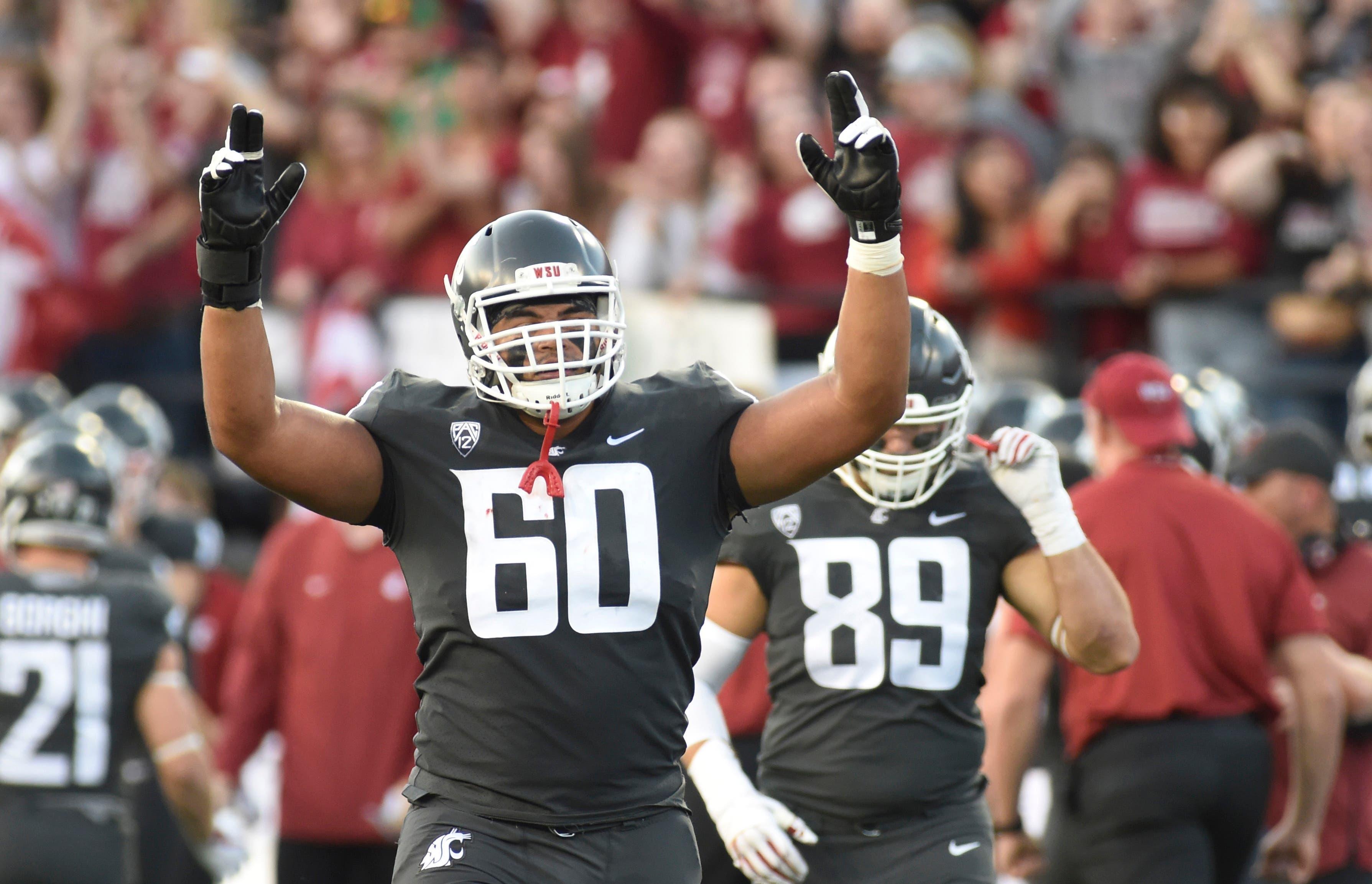 Oct 20, 2018; Pullman, WA, USA; Washington State Cougars offensive lineman Andre Dillard (60) celebrates a touchdown against the Oregon Ducks in the first half at Martin Stadium. Mandatory Credit: James Snook-USA TODAY Sports / James Snook