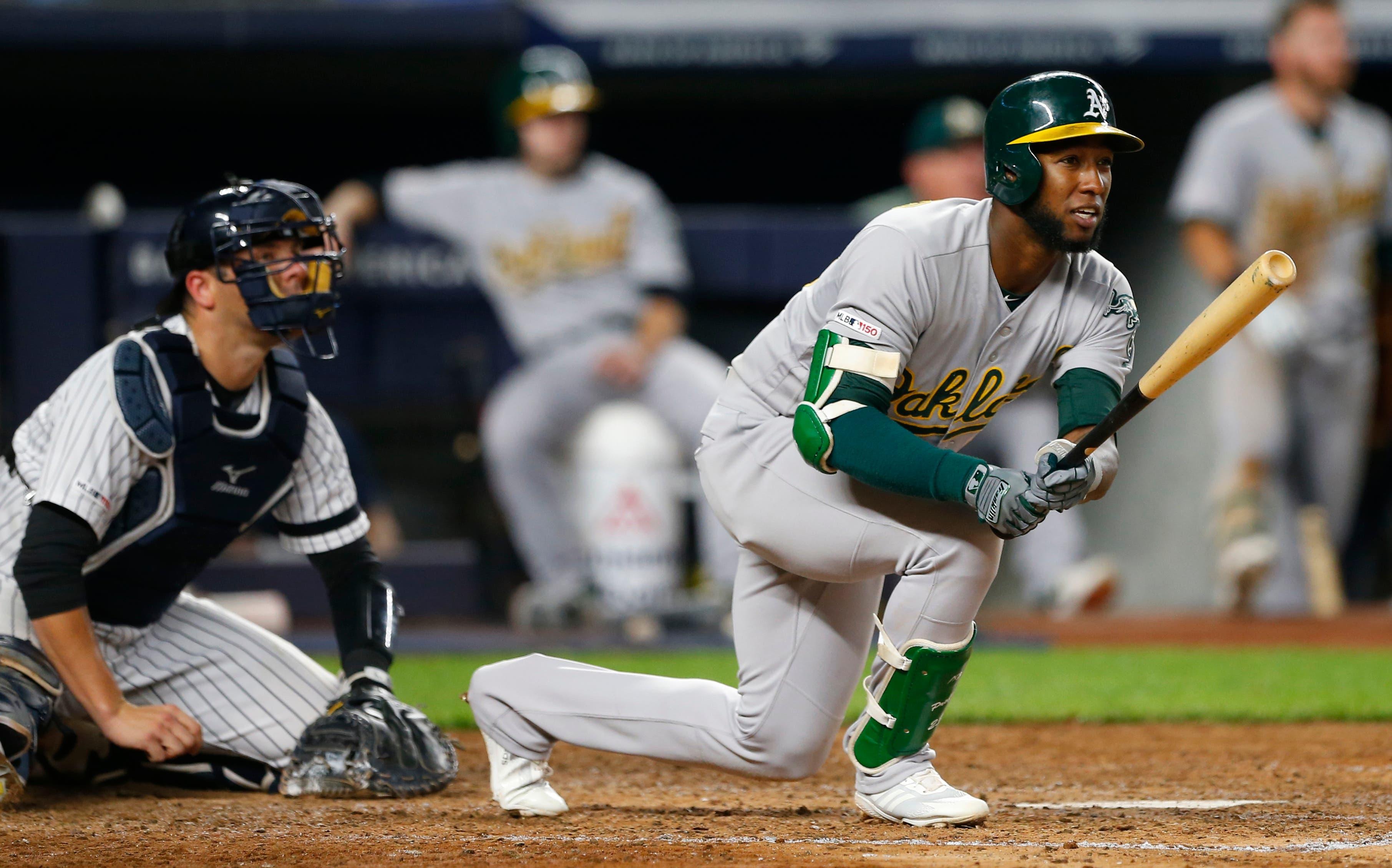 Aug 30, 2019; Bronx, NY, USA; Oakland Athletics second baseman Jurickson Profar (23) follows through on a double in the sixth inning against the New York Yankees at Yankee Stadium. Mandatory Credit: Noah K. Murray-USA TODAY Sports / Noah K. Murray