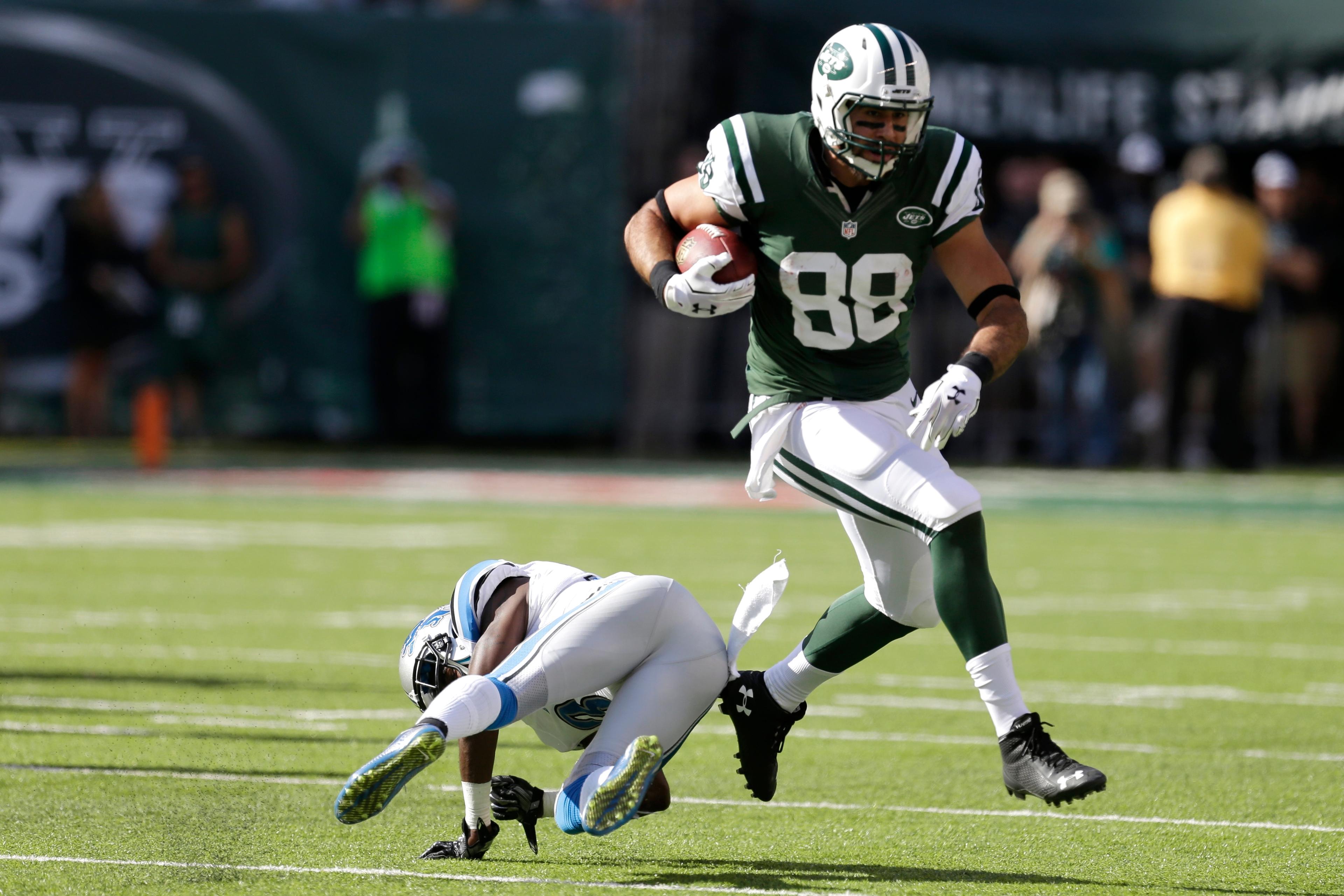 New York Jets tight end Jace Amaro (88) avoids a tackle by Detroit Lions defensive back Danny Gorrer (36) during the second half of an NFL football game, Sunday, Sept. 28, 2014, in East Rutherford, N.J. (AP Photo/Frank Franklin II)