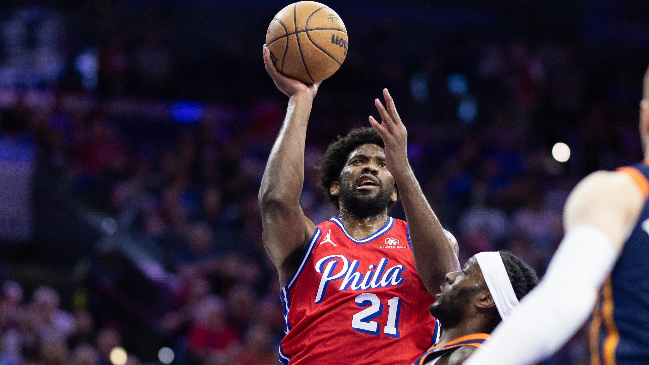 Apr 28, 2024; Philadelphia, Pennsylvania, USA; Philadelphia 76ers center Joel Embiid (21) drives for a shot against New York Knicks forward Precious Achiuwa (5) during the first half of game four of the first round in the 2024 NBA playoffs at Wells Fargo Center. Mandatory Credit: Bill Streicher-USA TODAY Sports / © Bill Streicher-USA TODAY Sports