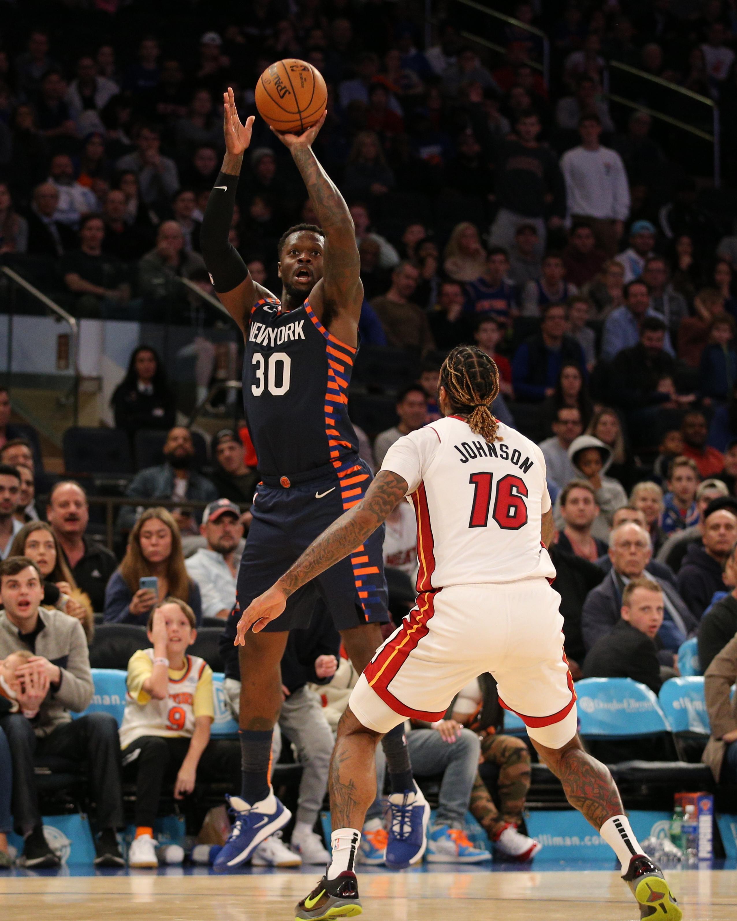 Jan 12, 2020; New York, New York, USA; New York Knicks power forward Julius Randle (30) shoots over Miami Heat power forward James Johnson (16) during the fourth quarter at Madison Square Garden. Mandatory Credit: Brad Penner-USA TODAY Sports