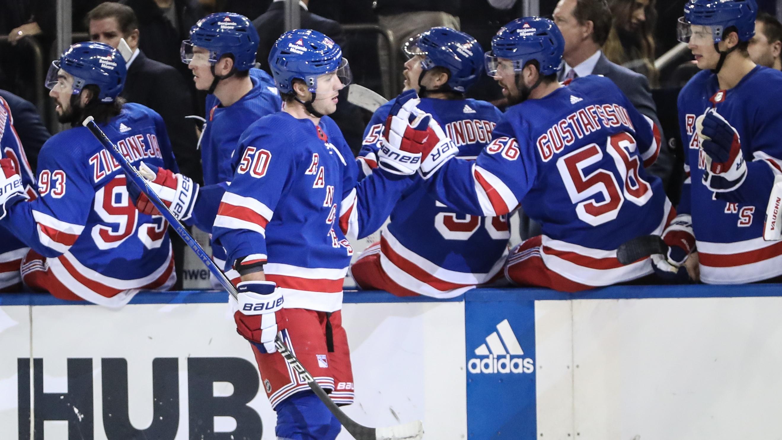 New York Rangers left wing Will Cuylle (50) celebrates with his teammates after scoring a goal in the third period against the Carolina Hurricanes at Madison Square Garden / Wendell Cruz - USA TODAY Sports