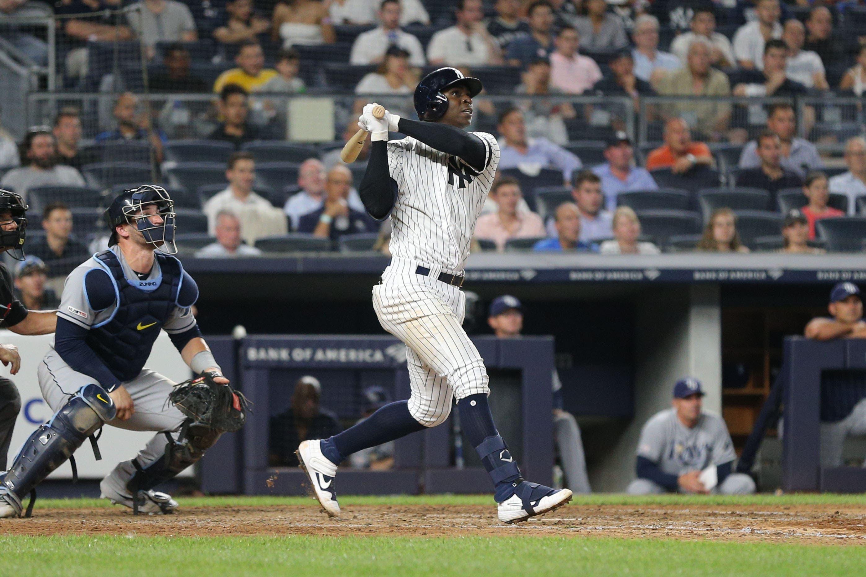 Jul 16, 2019; Bronx, NY, USA; New York Yankees shortstop Didi Gregorious (18) follows through on a grand slam against the Tampa Bay Rays during the eighth inning at Yankee Stadium. Mandatory Credit: Brad Penner-USA TODAY Sports / Brad Penner