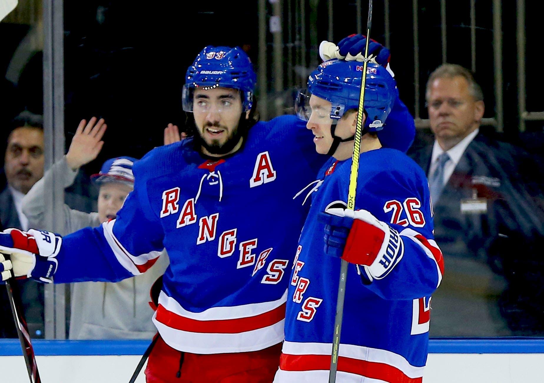 Oct 23, 2018; New York, NY, USA; New York Rangers center Mika Zibanejad (93) is congratulated by New York Rangers left wing Jimmy Vesey (26) after scoring a goal against the Florida Panthers during the second period at Madison Square Garden. Mandatory Credit: Andy Marlin-USA TODAY Sports / Andy Marlin