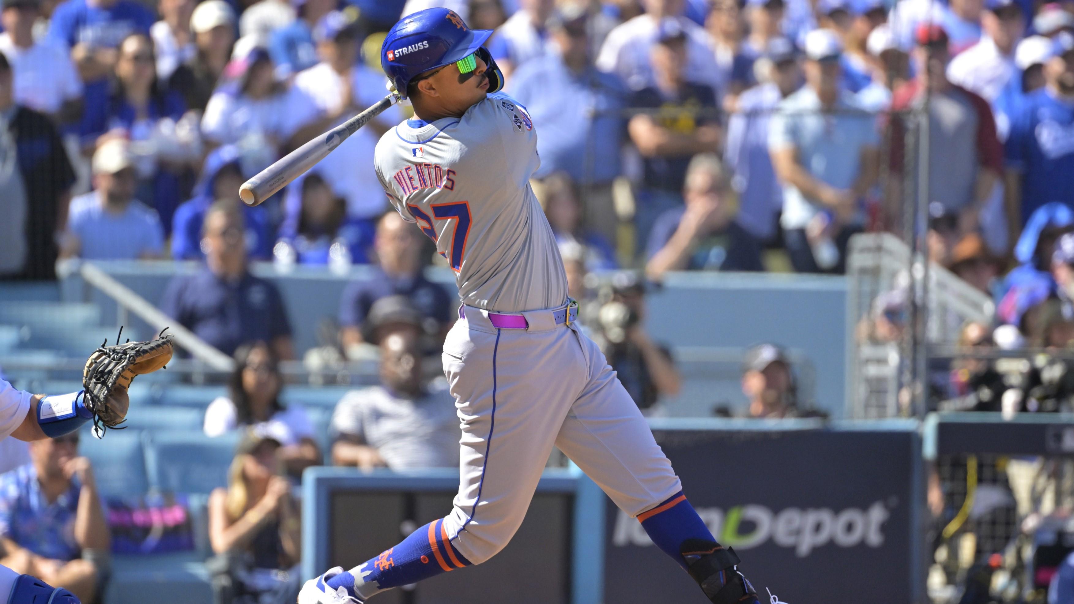 Oct 14, 2024; Los Angeles, California, USA; New York Mets third baseman Mark Vientos (27) hits a grand slam home run in the second inning against the Los Angeles Dodgers during game two of the NLCS for the 2024 MLB Playoffs at Dodger Stadium. 