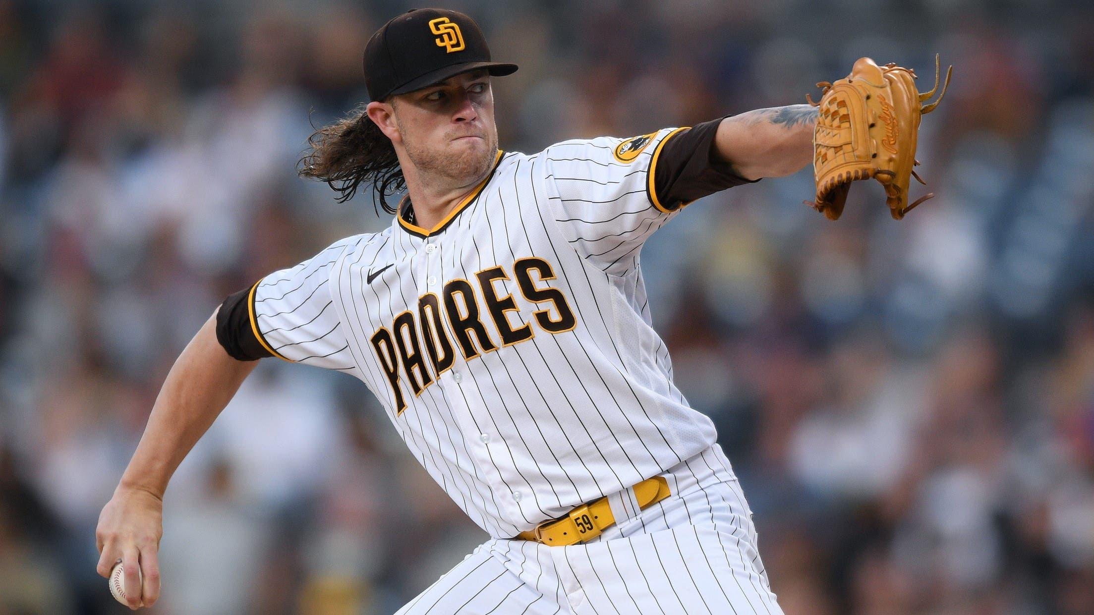 Jul 27, 2021; San Diego, California, USA; San Diego Padres starting pitcher Chris Paddack (59) throws a pitch against the Oakland Athletics during the first inning at Petco Park. / Orlando Ramirez-USA TODAY Sports