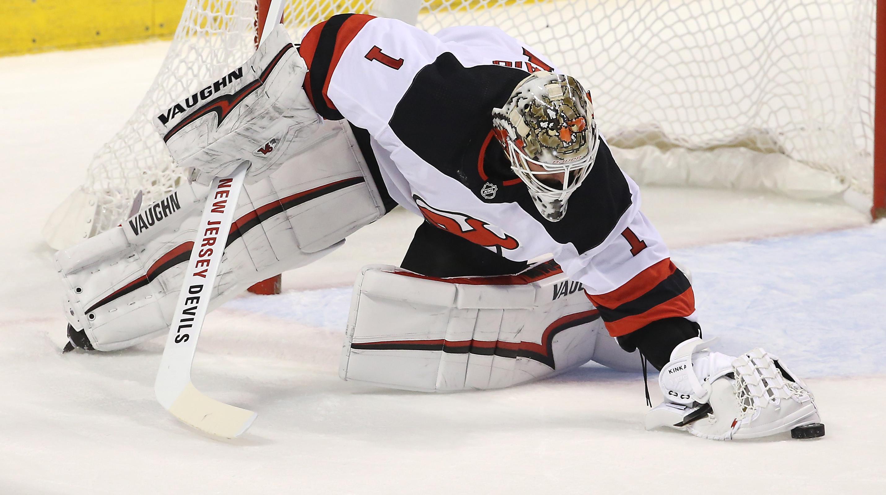 New Jersey Devils goaltender Keith Kinkaid makes a save in the first period of a game against the Florida Panthers at BB&T Center.