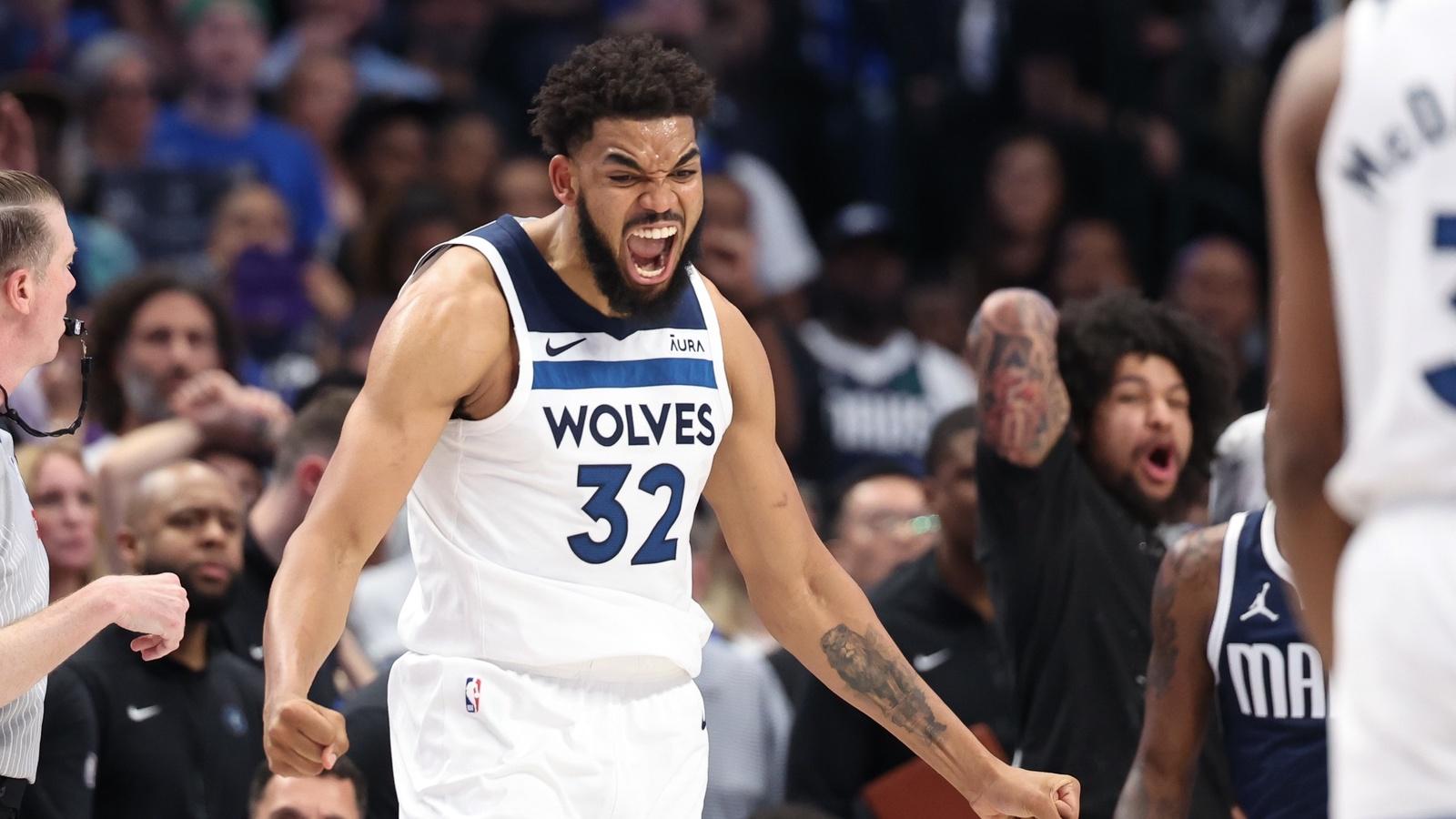 Minnesota Timberwolves center Karl-Anthony Towns (32) reacts during the fourth quarter against the Dallas Mavericks in game four of the western conference finals for the 2024 NBA playoffs at American Airlines Center.