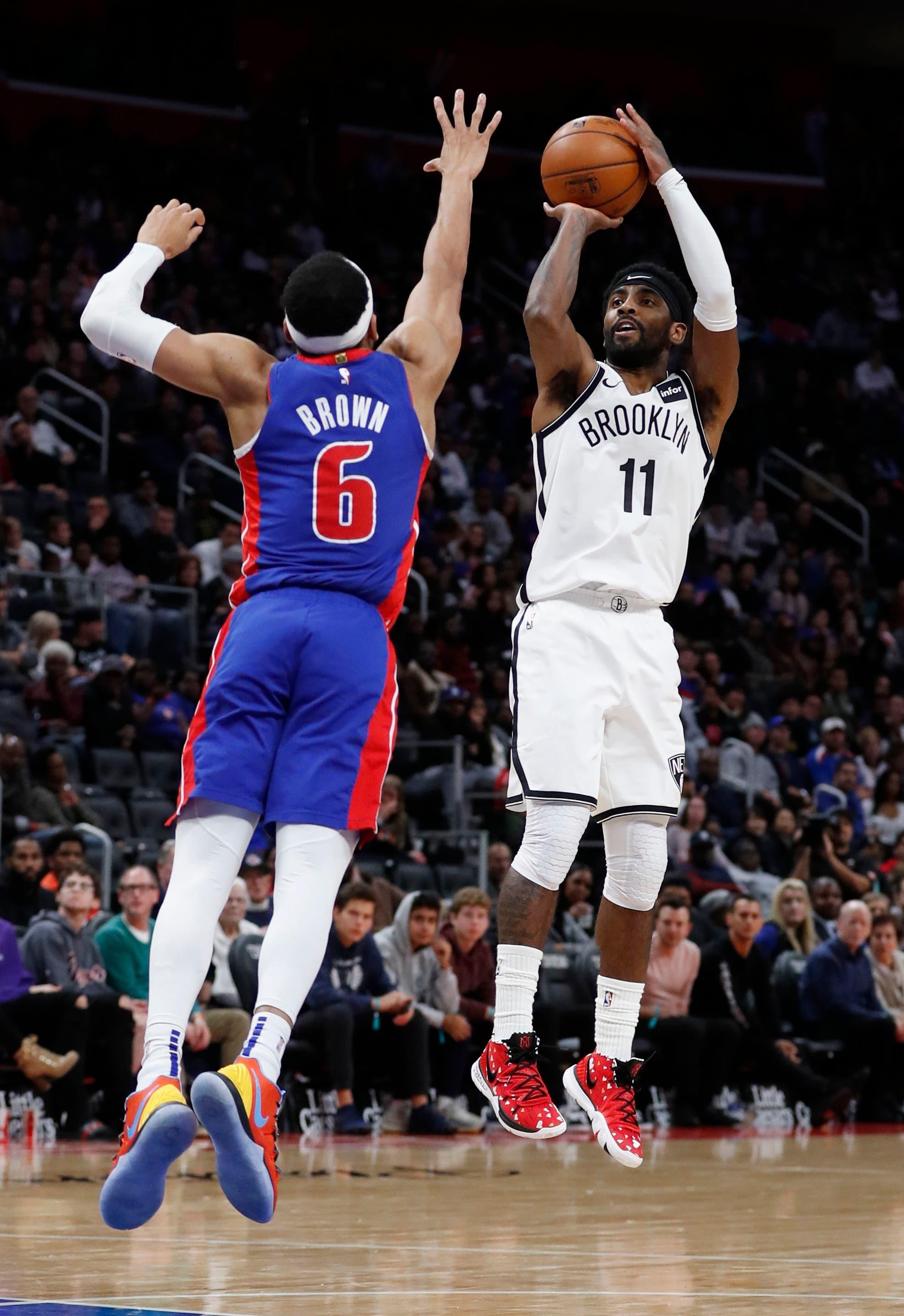 Nov 2, 2019; Detroit, MI, USA; Brooklyn Nets guard Kyrie Irving (11) shoots on Detroit Pistons guard Bruce Brown (6) in the second half at Little Caesars Arena. Mandatory Credit: Rick Osentoski-USA TODAY Sports / Rick Osentoski