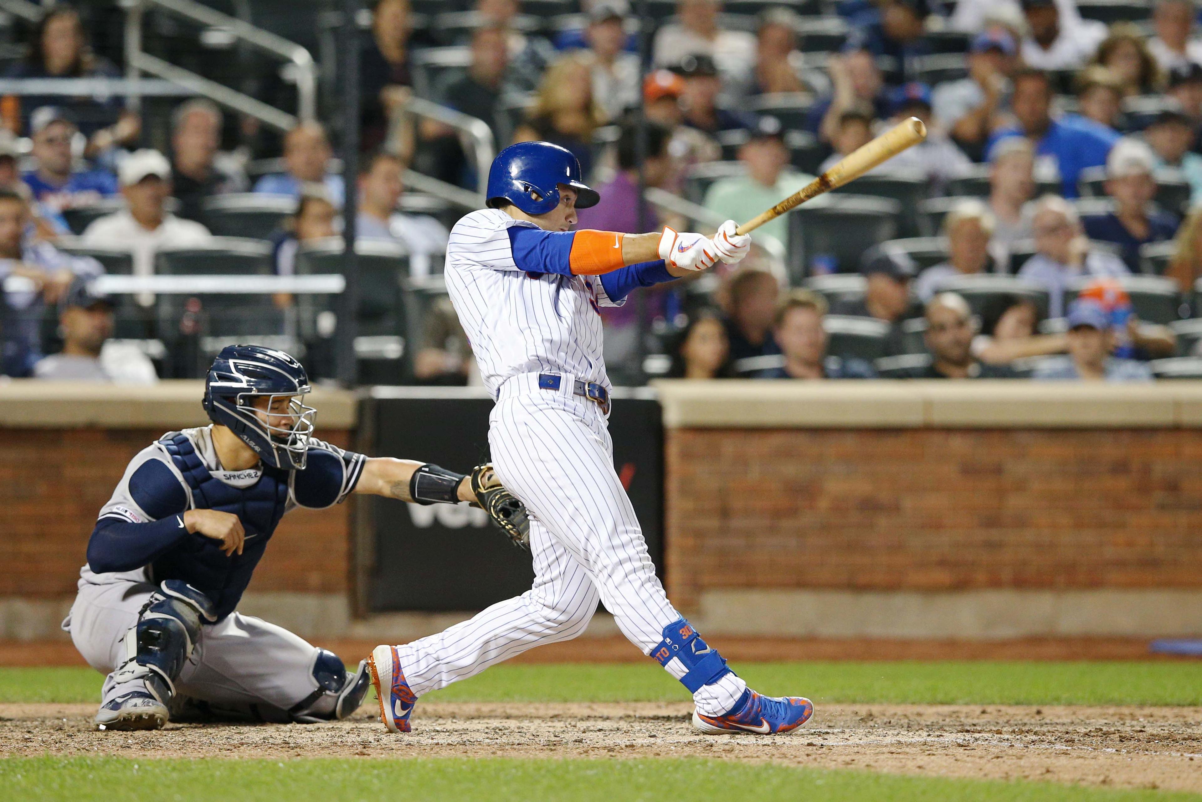 Jul 2, 2019; New York City, NY, USA; New York Mets center fielder Michael Conforto (30) hits a two run RBI double against the New York Yankees during the eighth inning at Citi Field. Mandatory Credit: Brad Penner-USA TODAY Sports