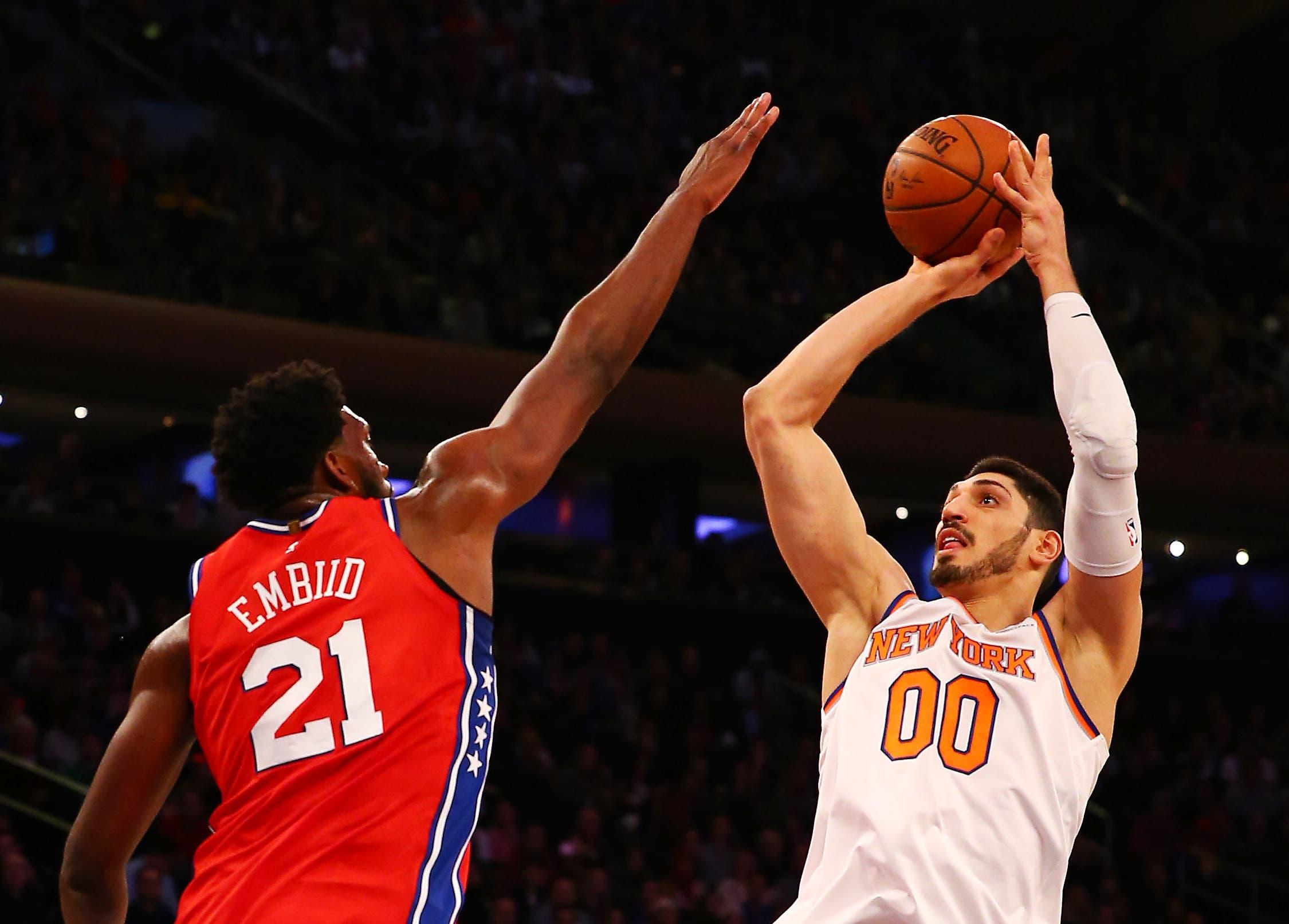 Dec 25, 2017; New York, NY, USA; New York Knicks center Enes Kanter (00) takes a shot against the Philadelphia 76ers cewnter Joel Embiid (21) during the first half at Madison Square Garden. Mandatory Credit: Andy Marlin-USA TODAY Sports / Andy Marlin