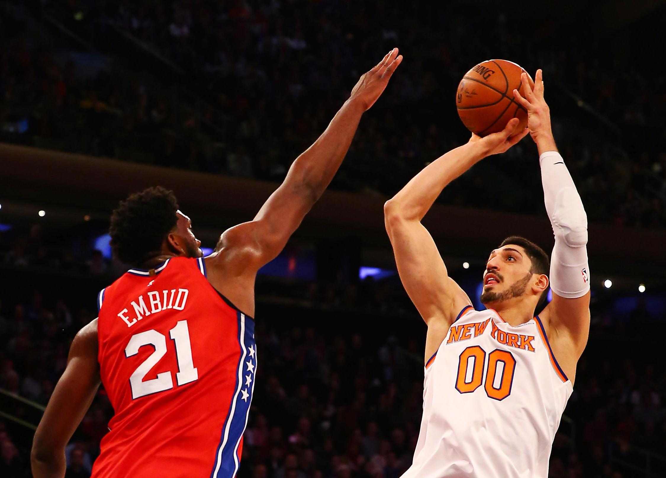 Dec 25, 2017; New York, NY, USA; New York Knicks center Enes Kanter (00) takes a shot against the Philadelphia 76ers cewnter Joel Embiid (21) during the first half at Madison Square Garden. Mandatory Credit: Andy Marlin-USA TODAY Sports