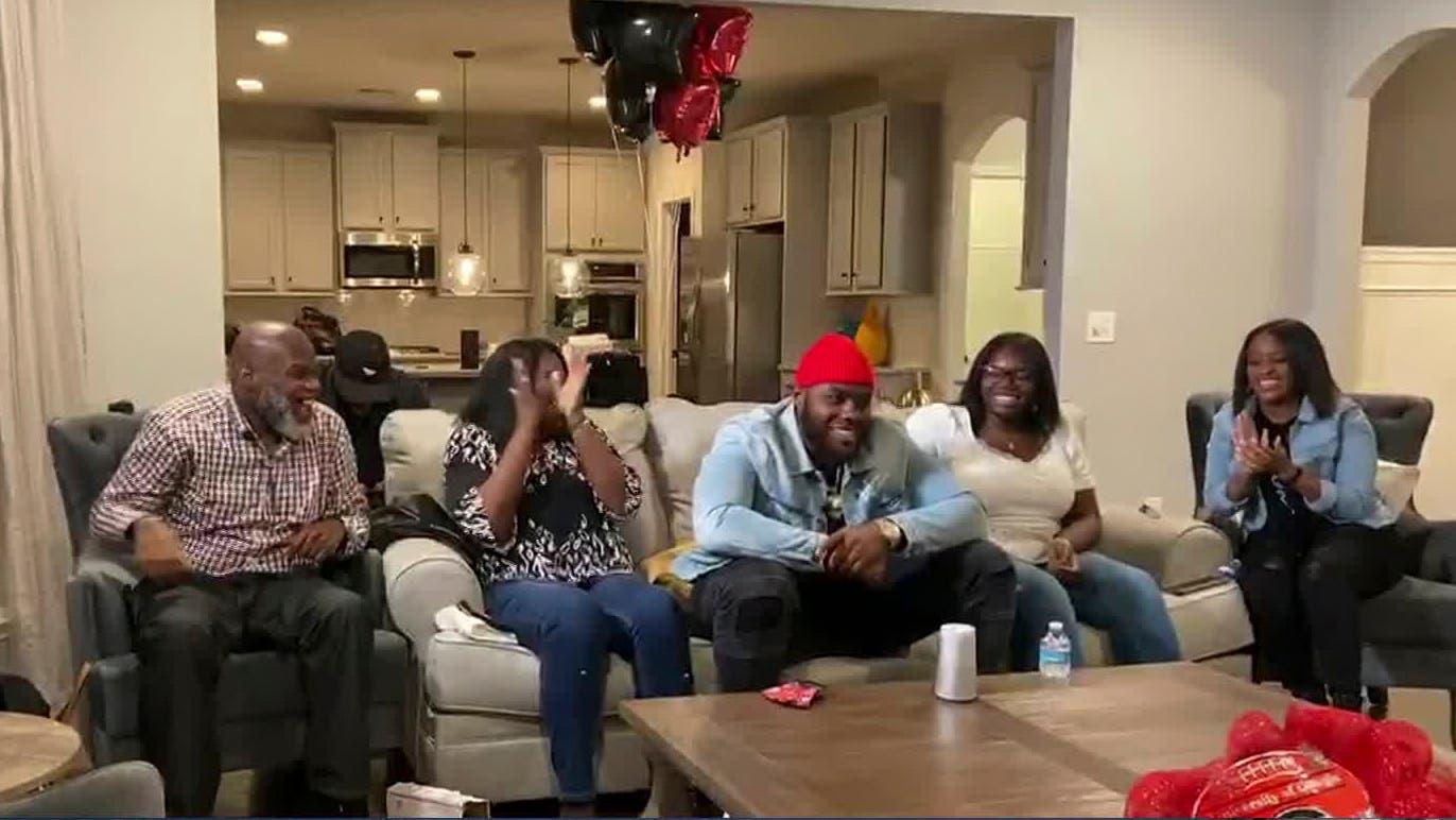 Apr 23, 2020; In this still image from video provided by the NFL, Andrew Thomas, center, smiles during the 2020 NFL Draft. Thomas was selected number four overall to the New York Giants. Mandatory Credit: NFL/Handout Photo via USA TODAY Sports / NFL Handout Photo