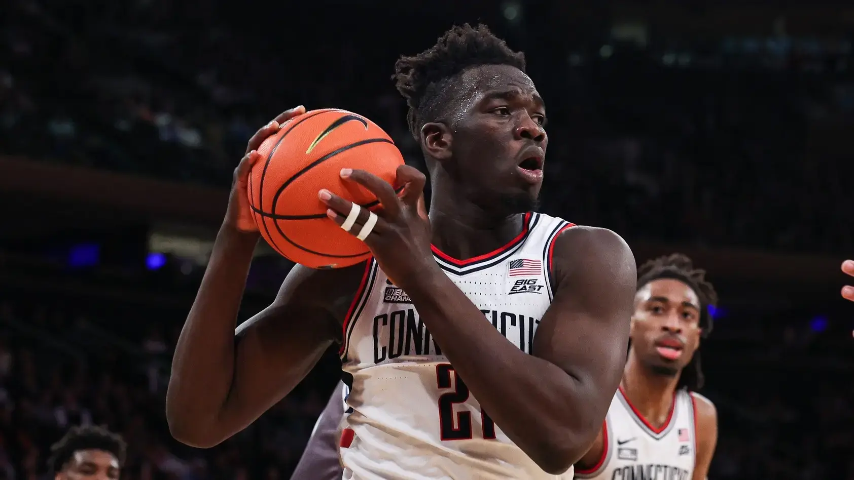 Mar 10, 2022; New York, NY, USA; Connecticut Huskies forward Adama Sanogo (21) secures a rebound against the Seton Hall Pirates during the first half at Madison Square Garden. / Vincent Carchietta-USA TODAY Sports