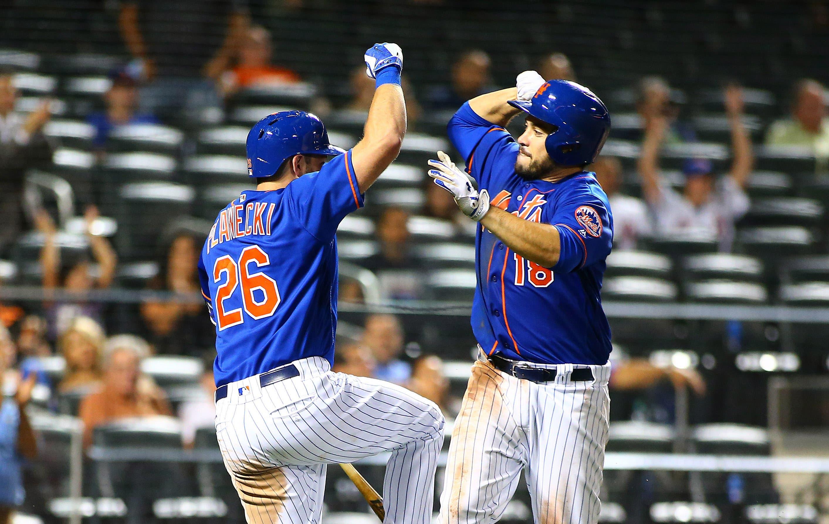 Sep 25, 2017; New York City, NY, USA; New York Mets catcher Travis d'Arnaud (18) is congratulated by first baseman Kevin Plawecki (26) after hitting the game winning home run against the Atlanta Braves during the eighth inning at Citi Field. Mandatory Credit: Andy Marlin-USA TODAY Sports / Andy Marlin