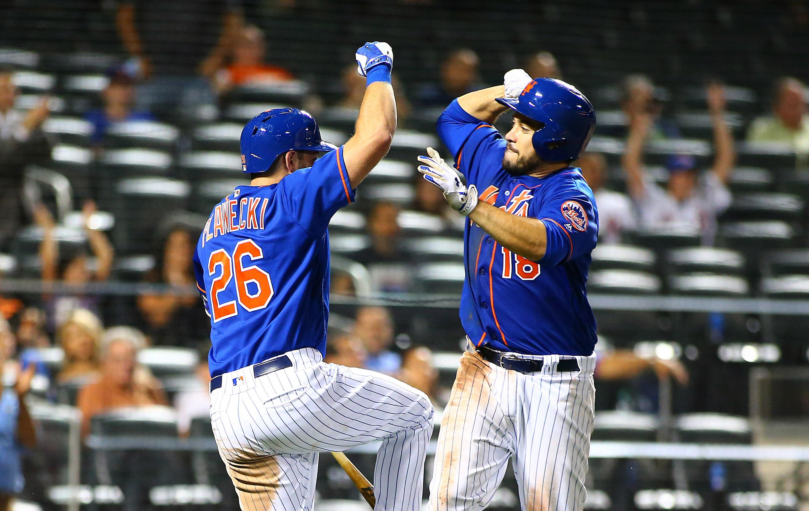 Sep 25, 2017; New York City, NY, USA; New York Mets catcher Travis d'Arnaud (18) is congratulated by first baseman Kevin Plawecki (26) after hitting the game winning home run against the Atlanta Braves during the eighth inning at Citi Field. Mandatory Credit: Andy Marlin-USA TODAY Sports