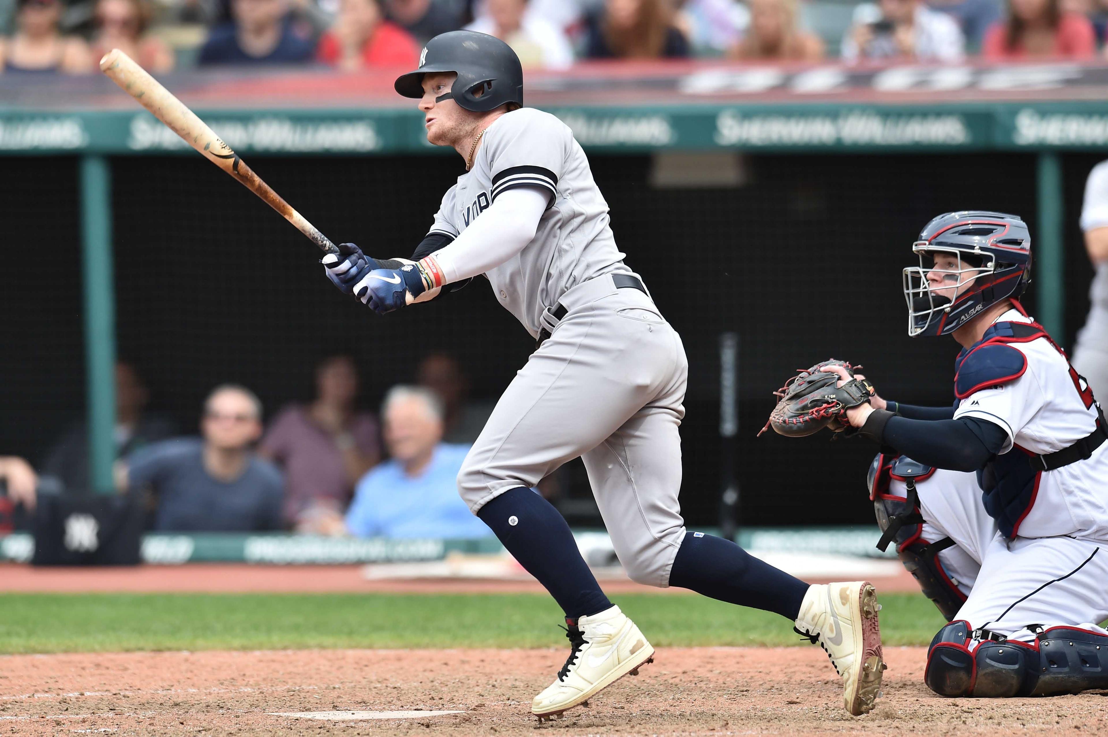 Jun 9, 2019; Cleveland, OH, USA; New York Yankees designated hitter Clint Frazier (77) hits a sacrifice fly during the ninth inning against the Cleveland Indians at Progressive Field. Mandatory Credit: Ken Blaze-USA TODAY Sports / Ken Blaze