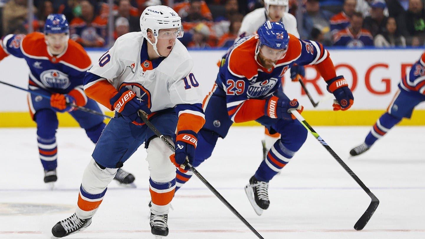 Nov 12, 2024; Edmonton, Alberta, CAN; New York Islanders forward Simon Holmstrom (10) looks to make a pass in front of Edmonton Oilers forward Leon Draisaitl (29) during the second period at Rogers Place. / Perry Nelson-Imagn Images