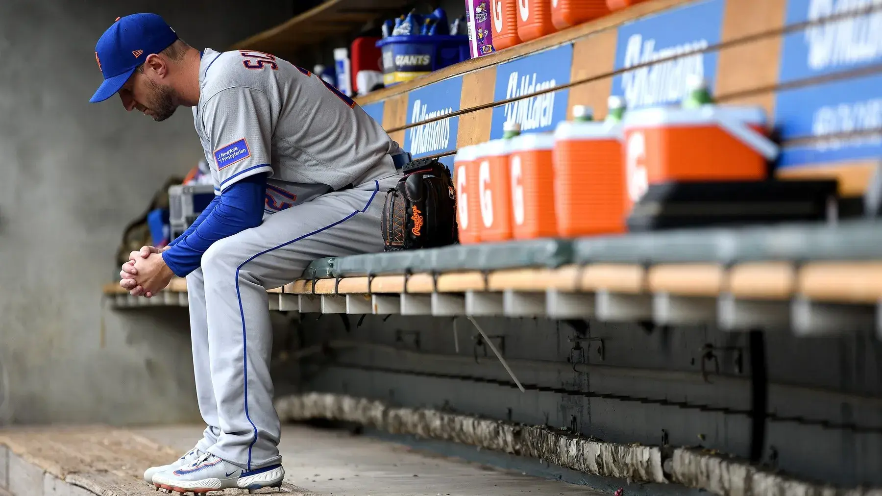 May 3, 2023; Detroit, Michigan, USA; New York Mets starting pitcher Max Scherzer (21) sits by himself on the dugout bench before heading to the bullpen to warm up for his start against the Detroit Tigers at Comerica Park. / Lon Horwedel-USA TODAY Sports