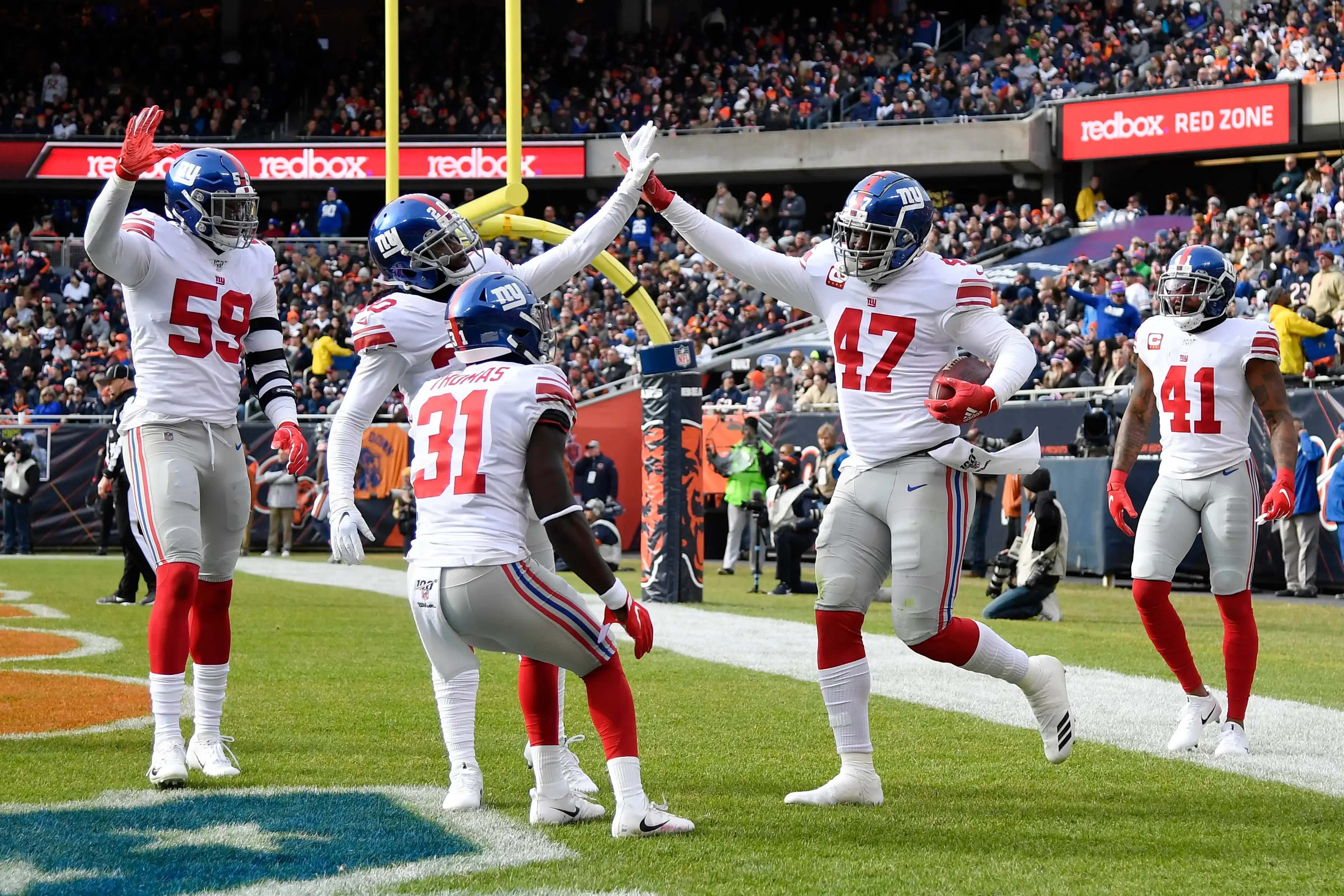 Nov 24, 2019; Chicago, IL, USA; New York Giants outside linebacker Alec Ogletree (47) and teammates celebrate the interception in the first half against the Chicago Bears at Soldier Field. / © Quinn Harris-USA TODAY Sports